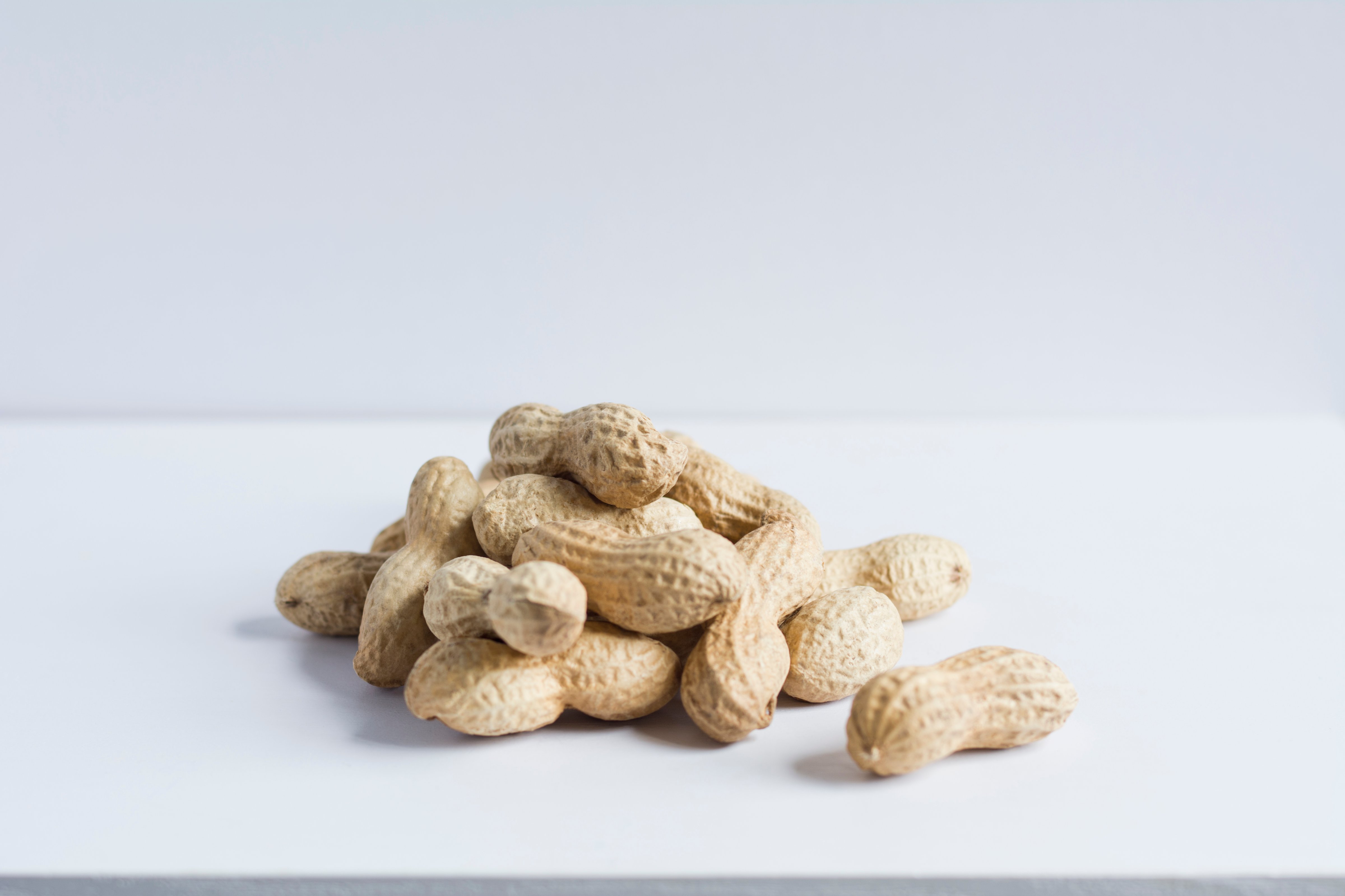 Pile of whole peanuts in shell