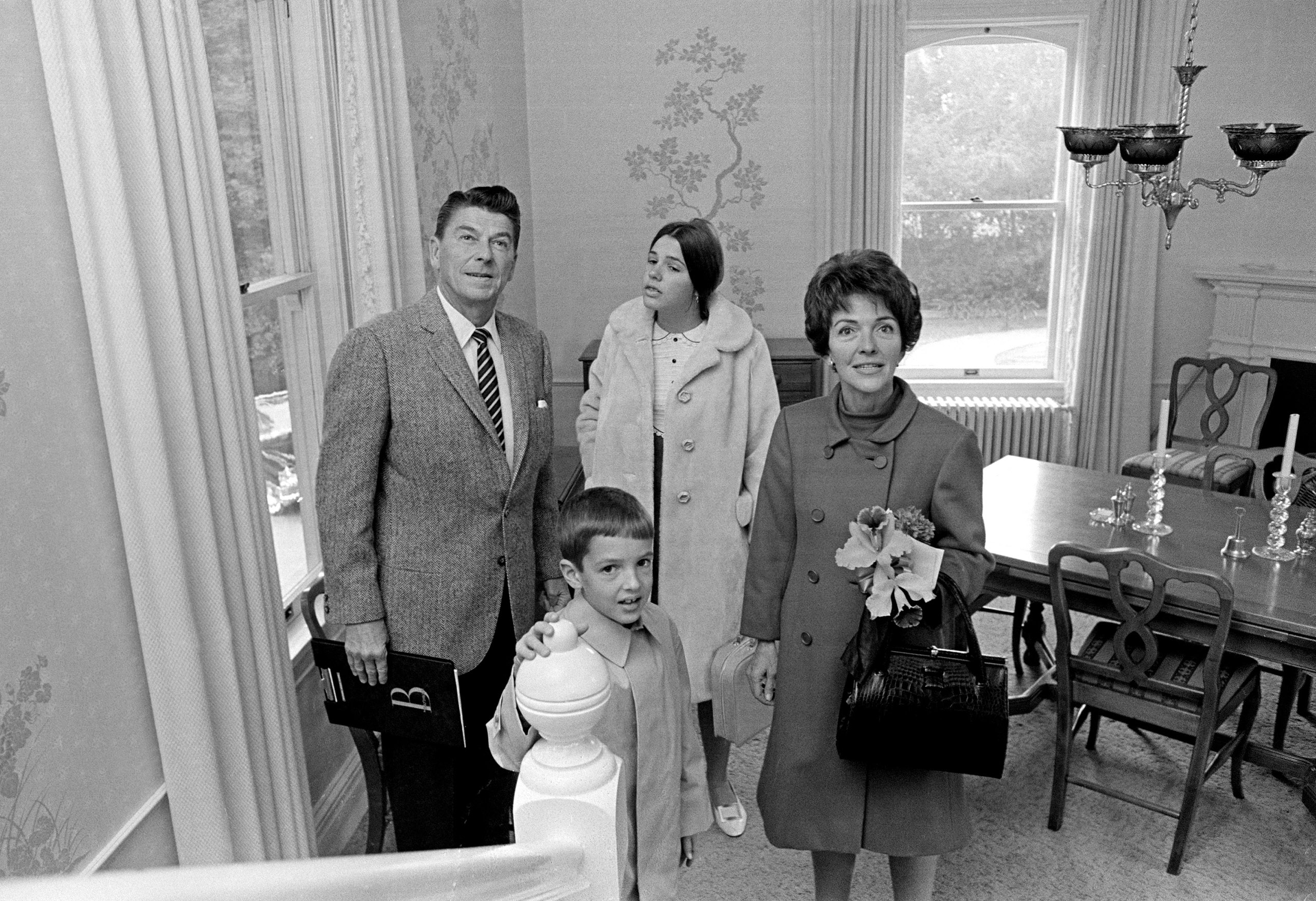 Ronald Reagan: A 1967 photograph captures Ronald, Nancy and their two children, Patricia, 13, and Ronald Jr., 8, as they take stock of their new home, the California governor's mansion. Ronald Jr. pursued careers as a ballet dancer and journalist; Patti was an outspoken opponent of many of her father's policies. During his first marriage to Jane Wyman, Reagan fathered two children, Maureen, an actress and public servant, and Christine, who died in infancy. They also adopted Michael, who became a popular syndicated talk-show host.