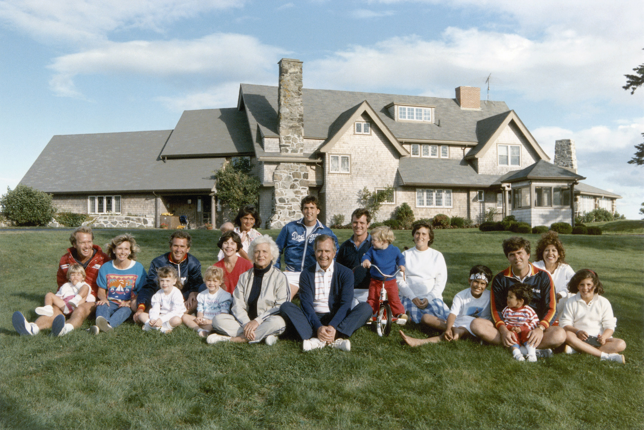 George H.W. Bush: The first President Bush and his wife Barbara have five living children, all of whom appear in this 1986 group shot taken in front of the family's Kennebunkport, Maine, home. Neil, a businessman, is at far left in the red jacket; George W., the 43rd President, is seated third from left; Marvin, an investment banker, is in the back row in the Dodgers jacket; Dorothy, known as  Doro,  is seated next to the child on the bicycle; and Jeb, the former governor of Florida, is toward the right with his children in a blue and red jacket.