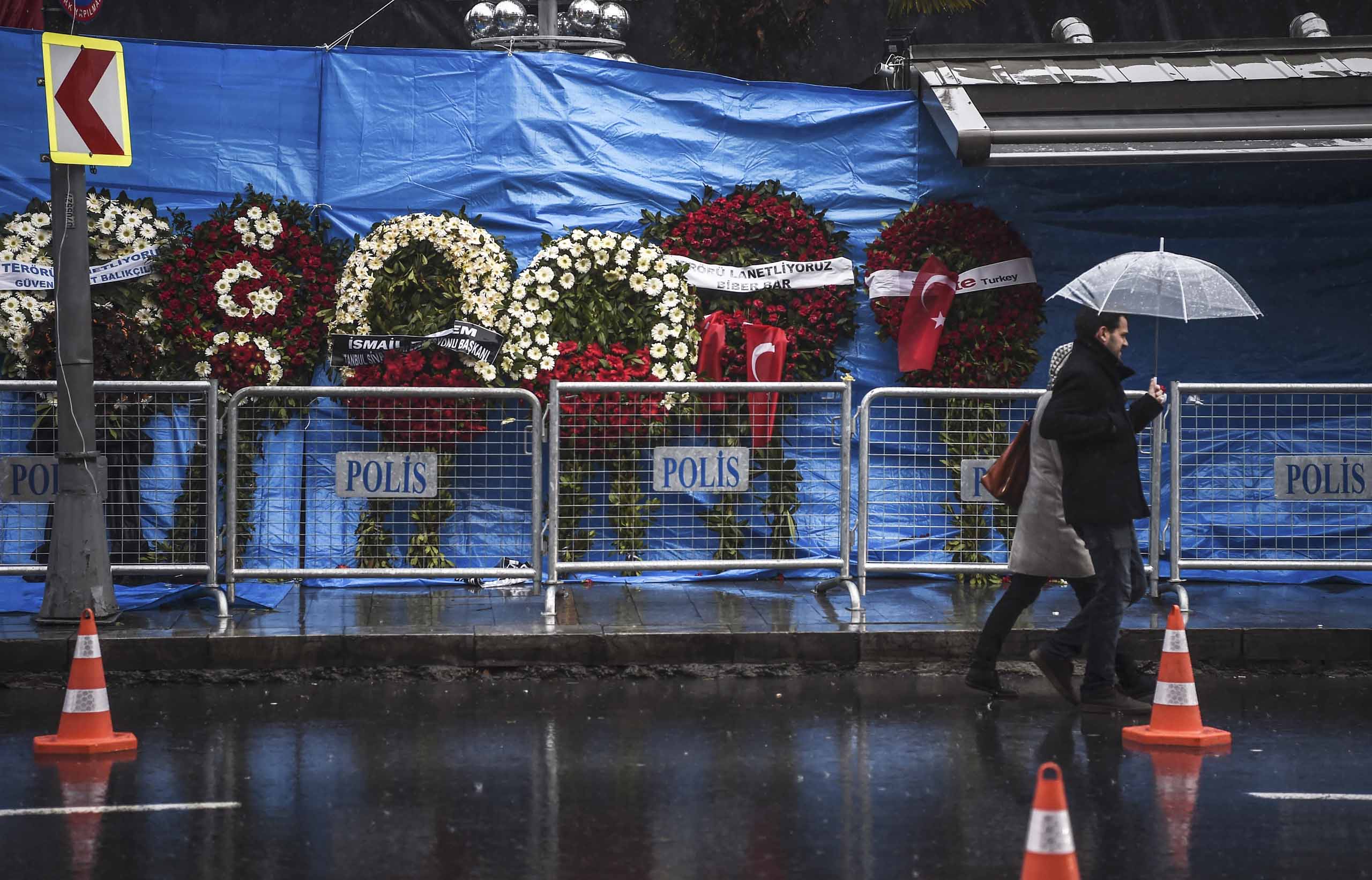 A couple walk past the Reina nightclub on January 5, 2017 in Istanbul, days after a gunman killed 39 people on New Year's night. 
                      The gunman who killed 39 people at an Istanbul nightclub had fought in Syria for Islamic State jihadists, a report said on January 3, as Turkish authorities intensified their hunt for the attacker. Of the 39 dead, 27 were foreigners, mainly from Arab countries, with coffins repatriated overnight to countries including Lebanon and Saudi Arabia. / AFP / OZAN KOSE        (Photo credit should read OZAN KOSE/AFP/Getty Images) (OZAN KOSE—AFP/Getty Images)