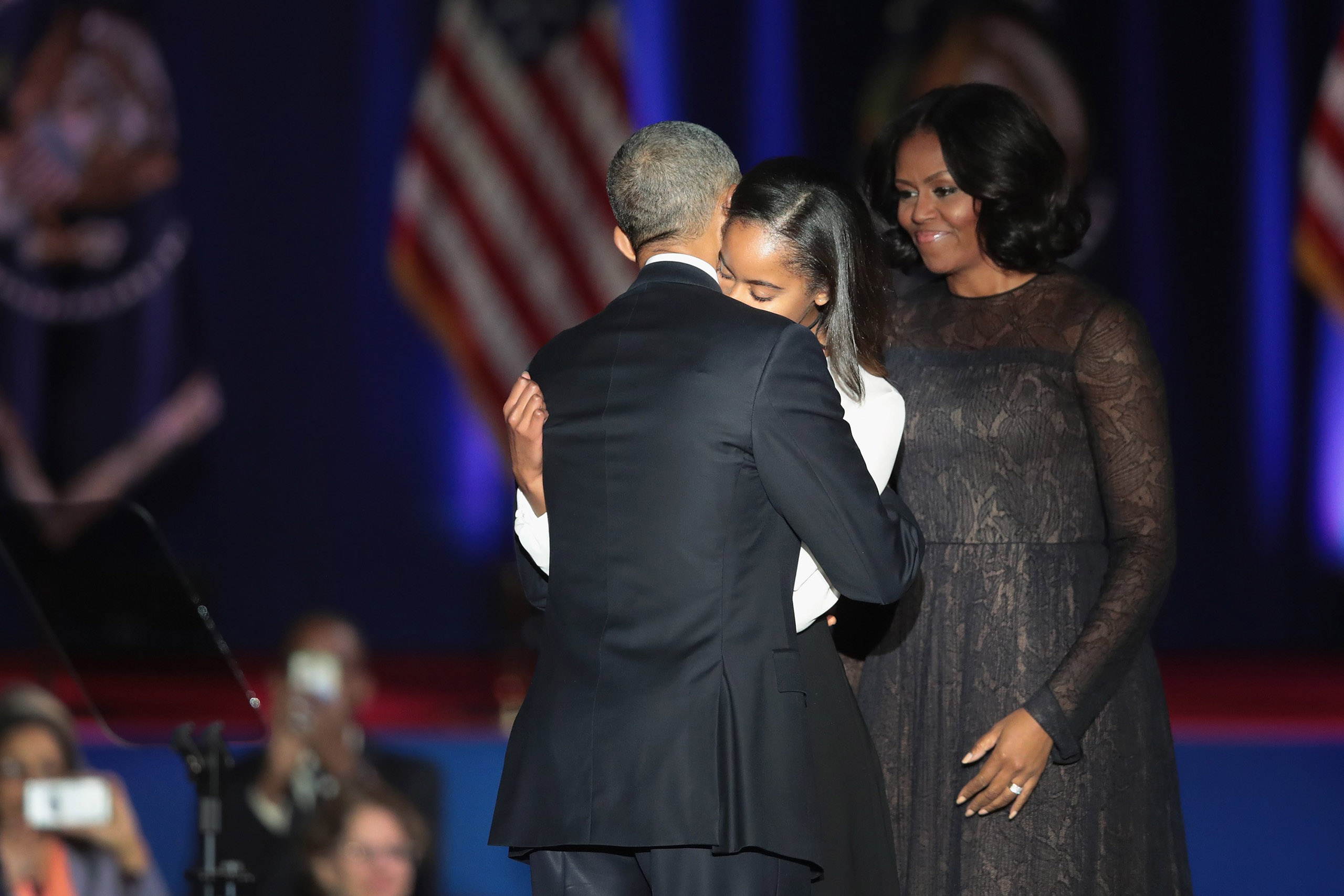 President Obama hugs his daughter Malia following his farewell speech to the nation in Chicago, on Jan. 10, 2017.