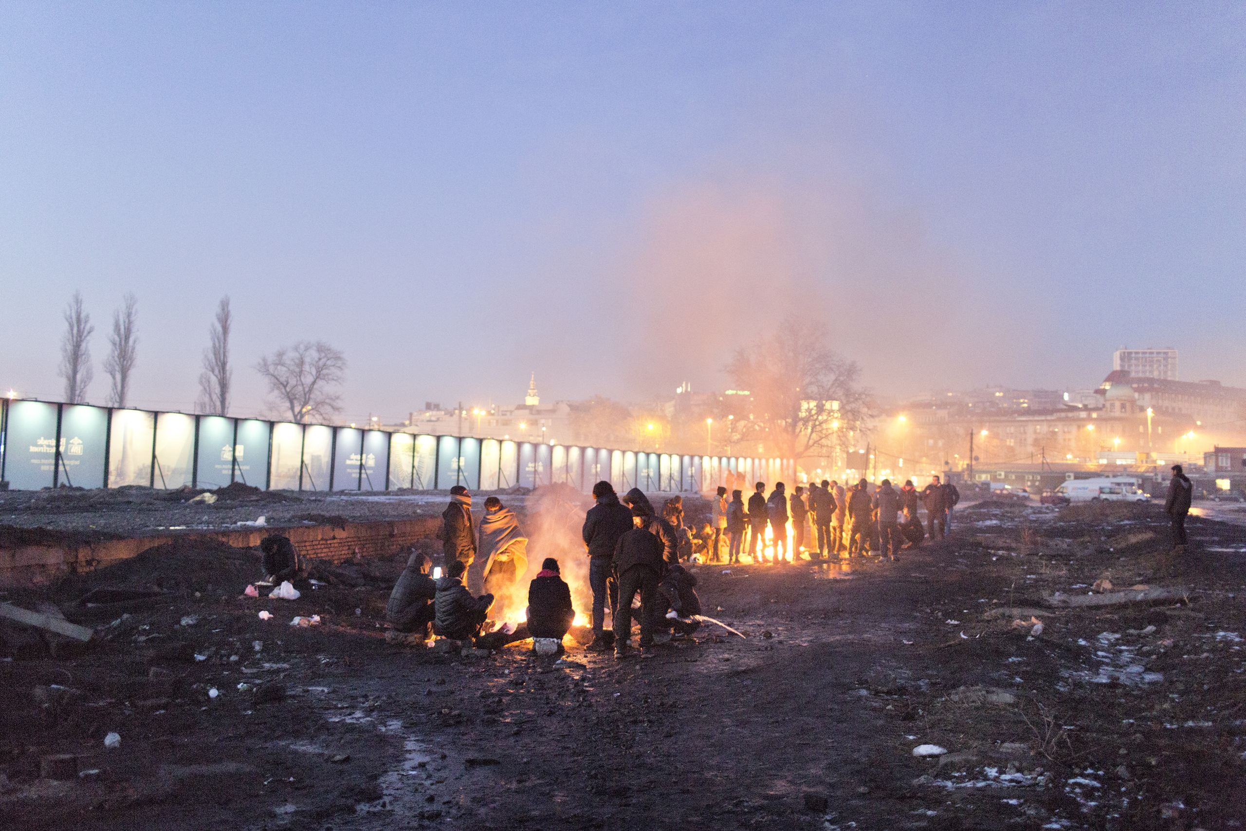 A group of migrants from Pakistan  and Afghanistan try to keep warm by a fire near an abandoned warehouse, Belgrade, Jan. 14, 2017.
                              
                              More than a thousand refugees, mostly Afghanis, live on the streets in central Belgrade. They live in terrible conditions and face freezing temperatures, while awaiting an opportunity to enter the European Union.