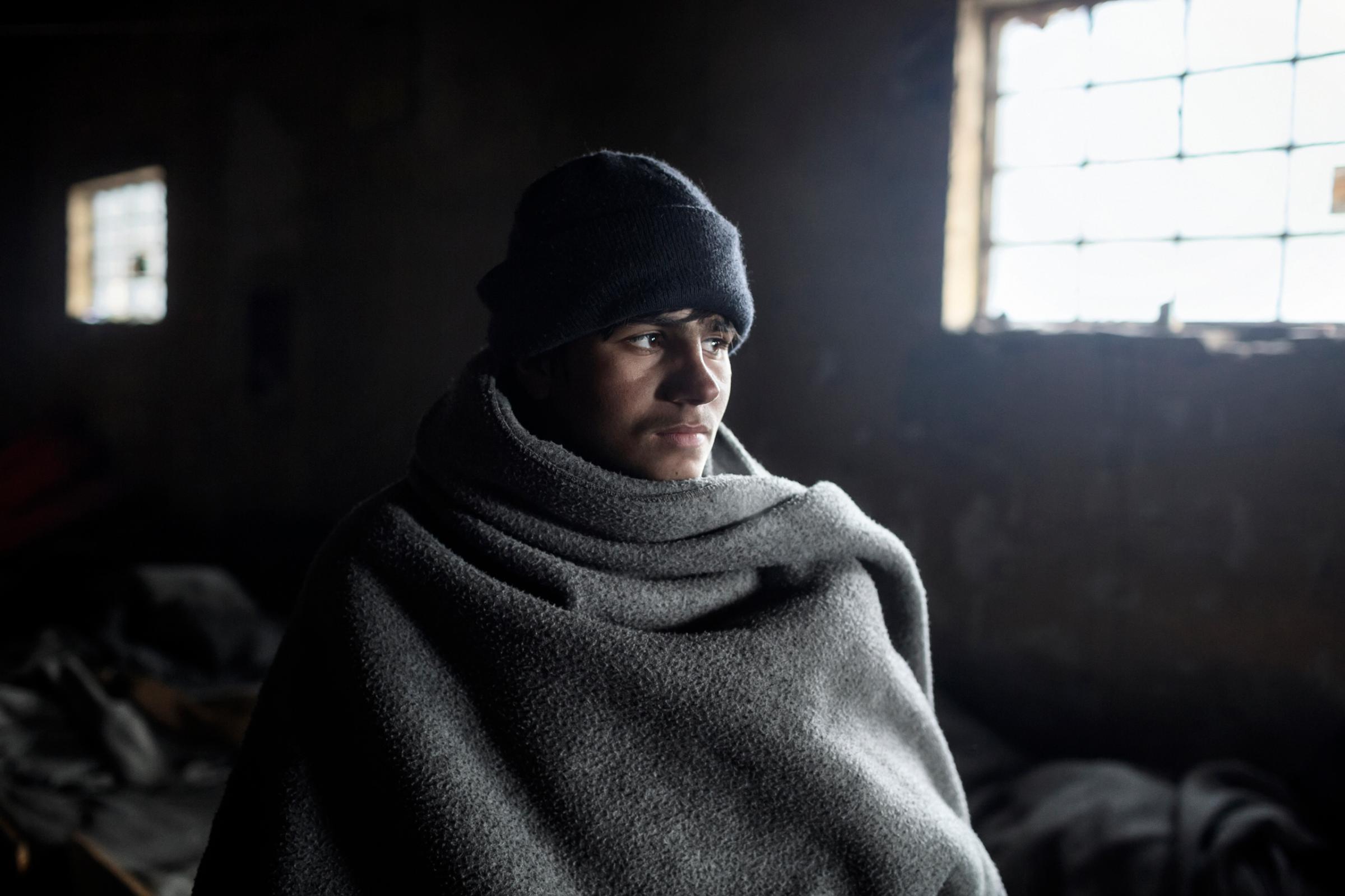 Handar, 14, an unaccompanied minor from Afghanistan living in an abandoned building near the train station in Belgrade. 