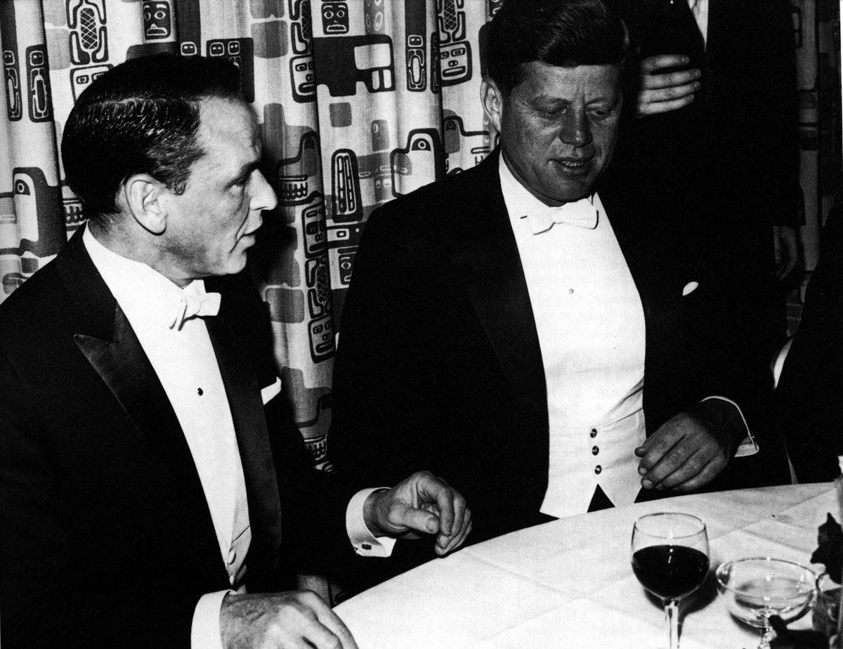Frank Sinatra with President John F. Kennedy at Kennedy's inaugural ball at the Mayflower Hotel in Washington D.C, Jan. 20, 1961. (GAB Archive / Redferns / Getty Images)