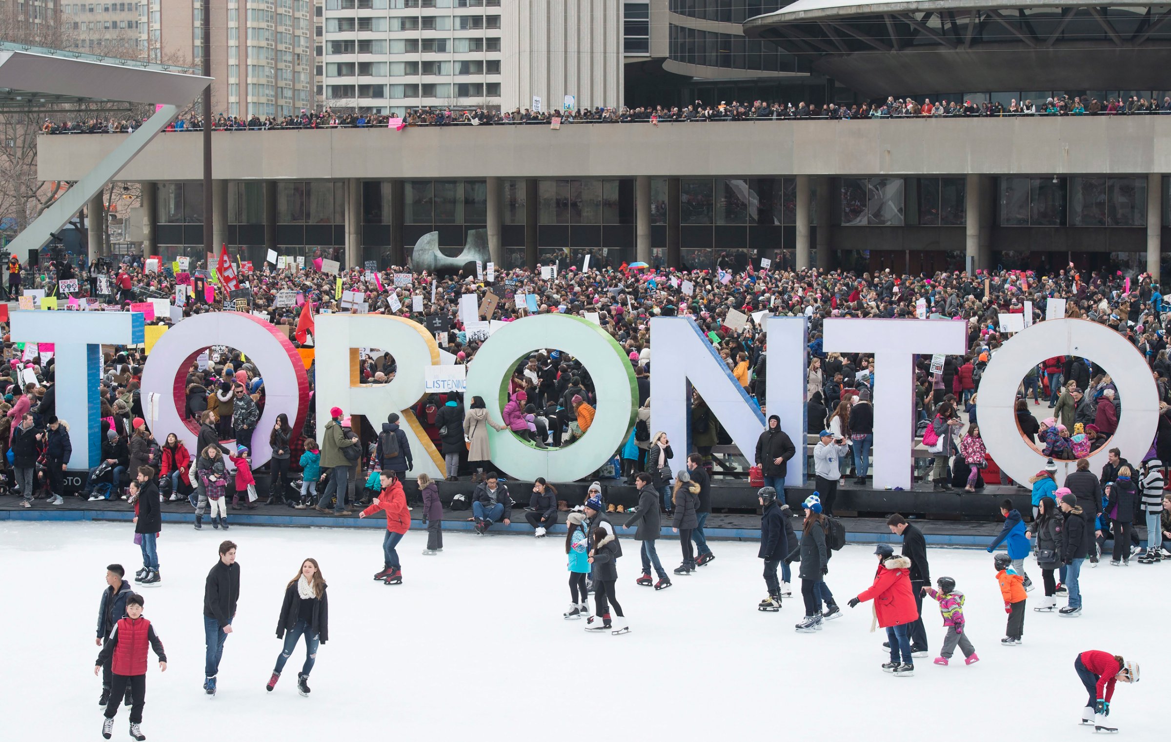 Protesters march gather in Nathan Phillips Square, in support of the Women's March on Washington, in Toronto on Saturday, January 21, 2017. Protests are being held across Canada today in support of the Women's March on Washington. Organizers say 30 events in all have been organized across Canada, including Ottawa, Toronto, Montreal and Vancouver. (Frank Gunn/The Canadian Press via AP)