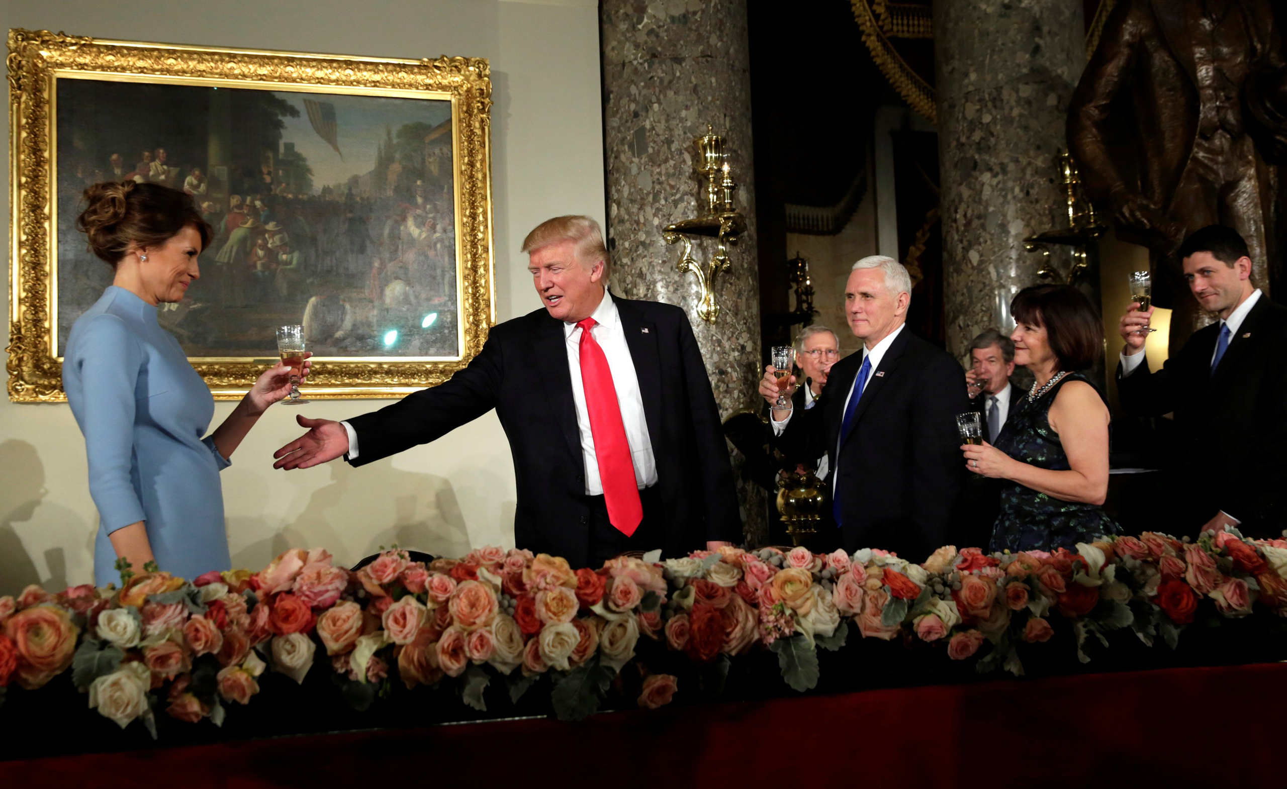 President Donald Trump gestures during a toast at the Inaugural luncheon