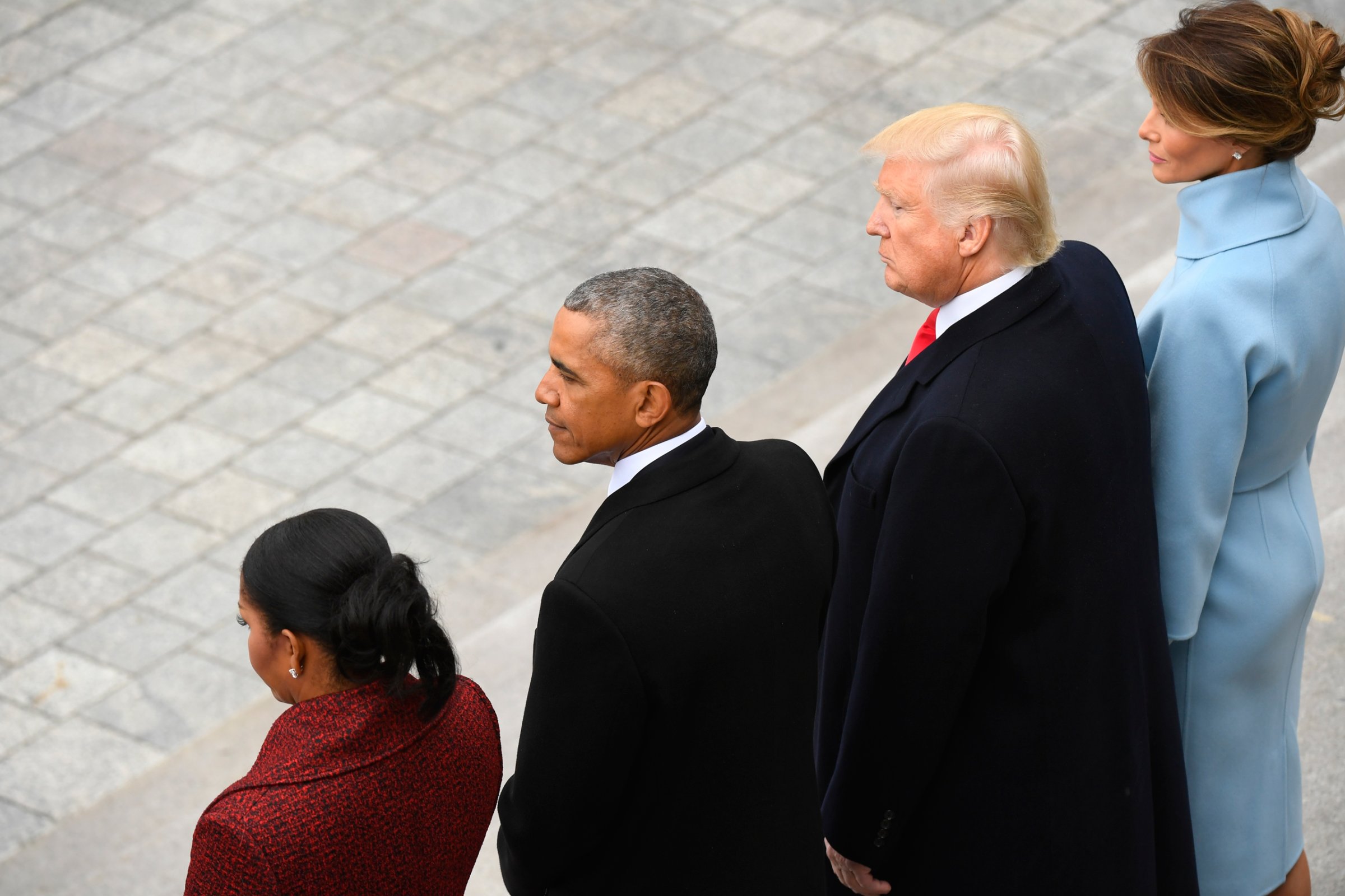 Former President Barack Obama and his wife Michelle Obama stand with President Donald Trump and his wife Melania Trump on the East front of the Capitol Hill in Washington, Friday, Jan. 20, 2017, prior to the Obama's departure from the presidential inauguration . (Jack Gruber/Pool Photo via AP)