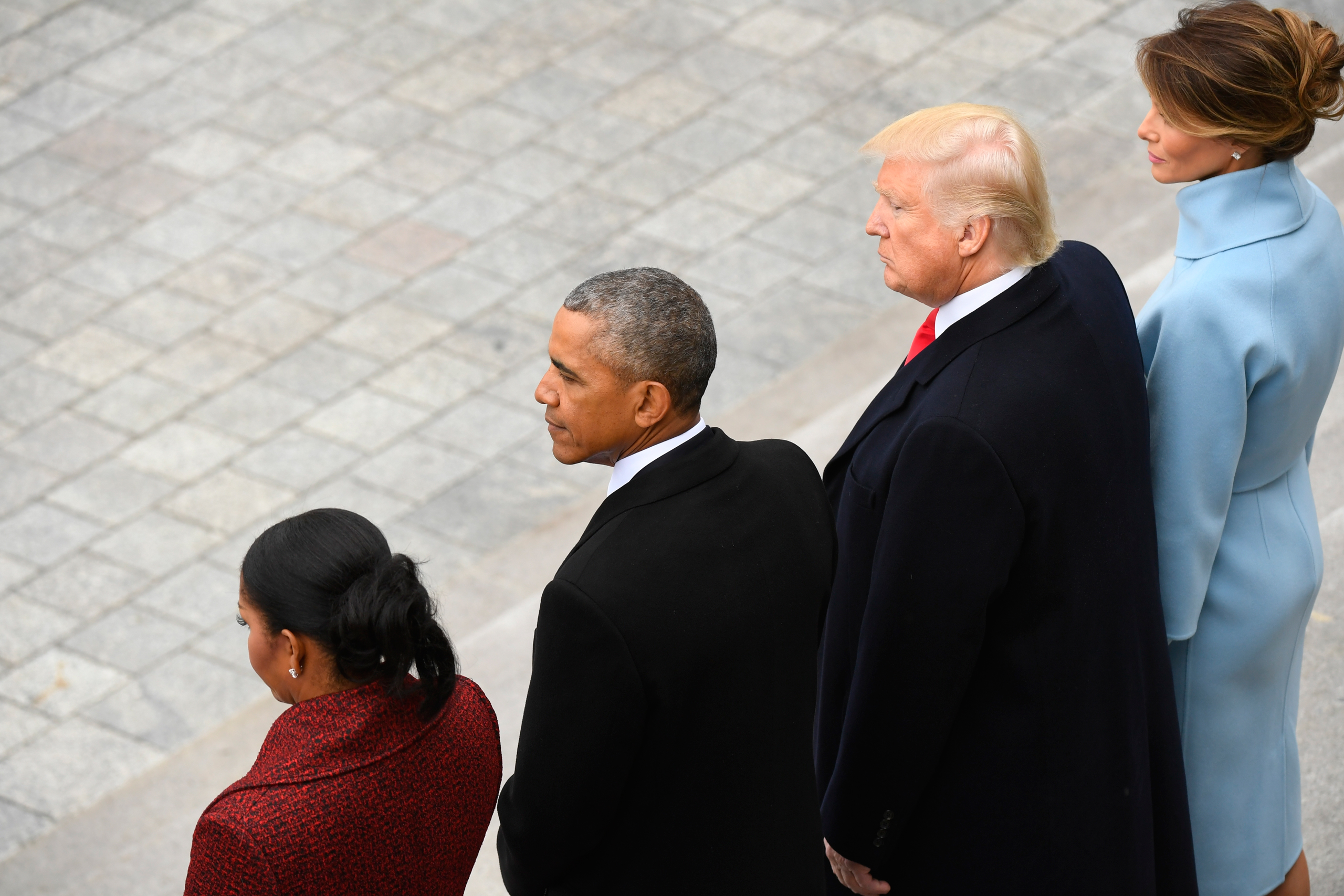 Former President Barack Obama and his wife Michelle Obama stand with President Donald Trump and his wife Melania Trump on the East front 
                      of the Capitol Hill in Washington on Jan. 20, 2017. (Jack Gruber—AP)