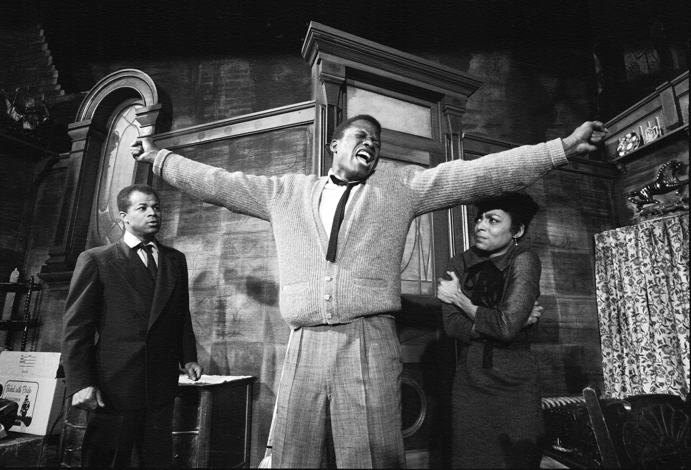 Sidney Poitier in a dramatic scene from play "A Raisin in the Sun", with Ruby Dee, 1959.