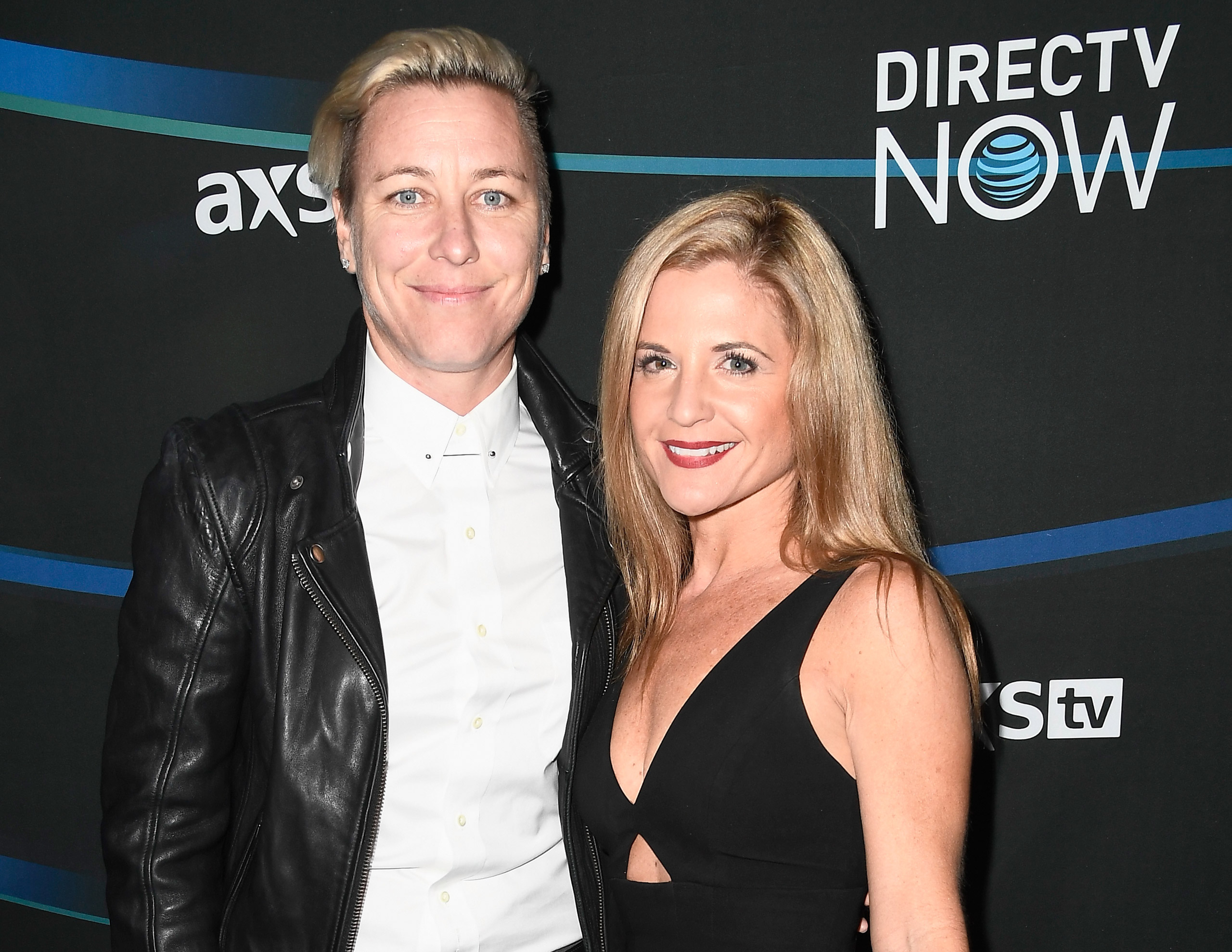 Former U.S. Women's Soccer player Abby Wambach (left) and Glennon Doyle Melton attend the 2017 DIRECTV NOW Super Saturday Night Concert at Club Nomadic in Houston on Feb. 4, 2017. (Frazer Harrison—Getty Images for DIRECTV)
