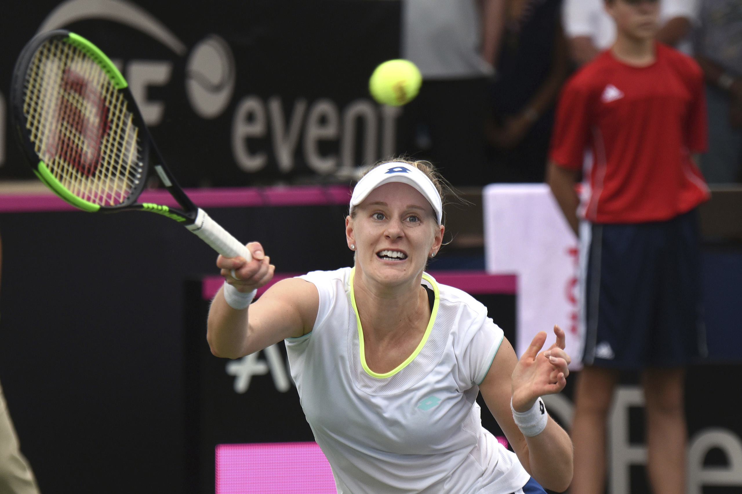 United States' Alison Riske returns to Germany's Andrea Petkovic in a Fed Cup tennis quarterfinal in Lahaina, Hawaii, Saturday, Feb. 11, 2017. (Matthew Thayer—The Maui News/AP)