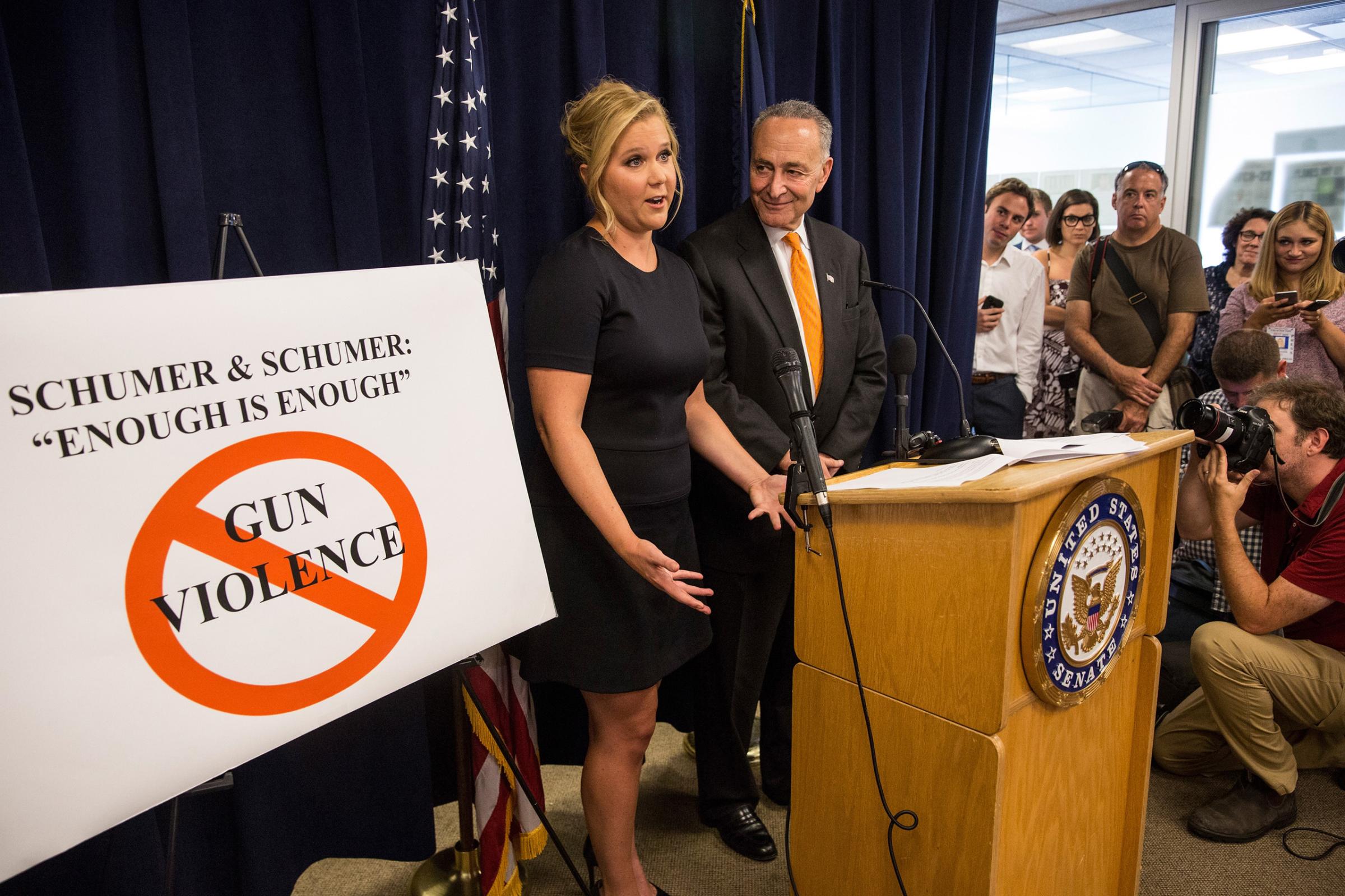 Comedian Amy Schumer (L) and her cousin Sen. Chuck Schumer (D-NY) speak at a press conference calling for tighter gun laws in an effort to stop mass shootings and gun violence in New York City, Aug. 3, 2015.