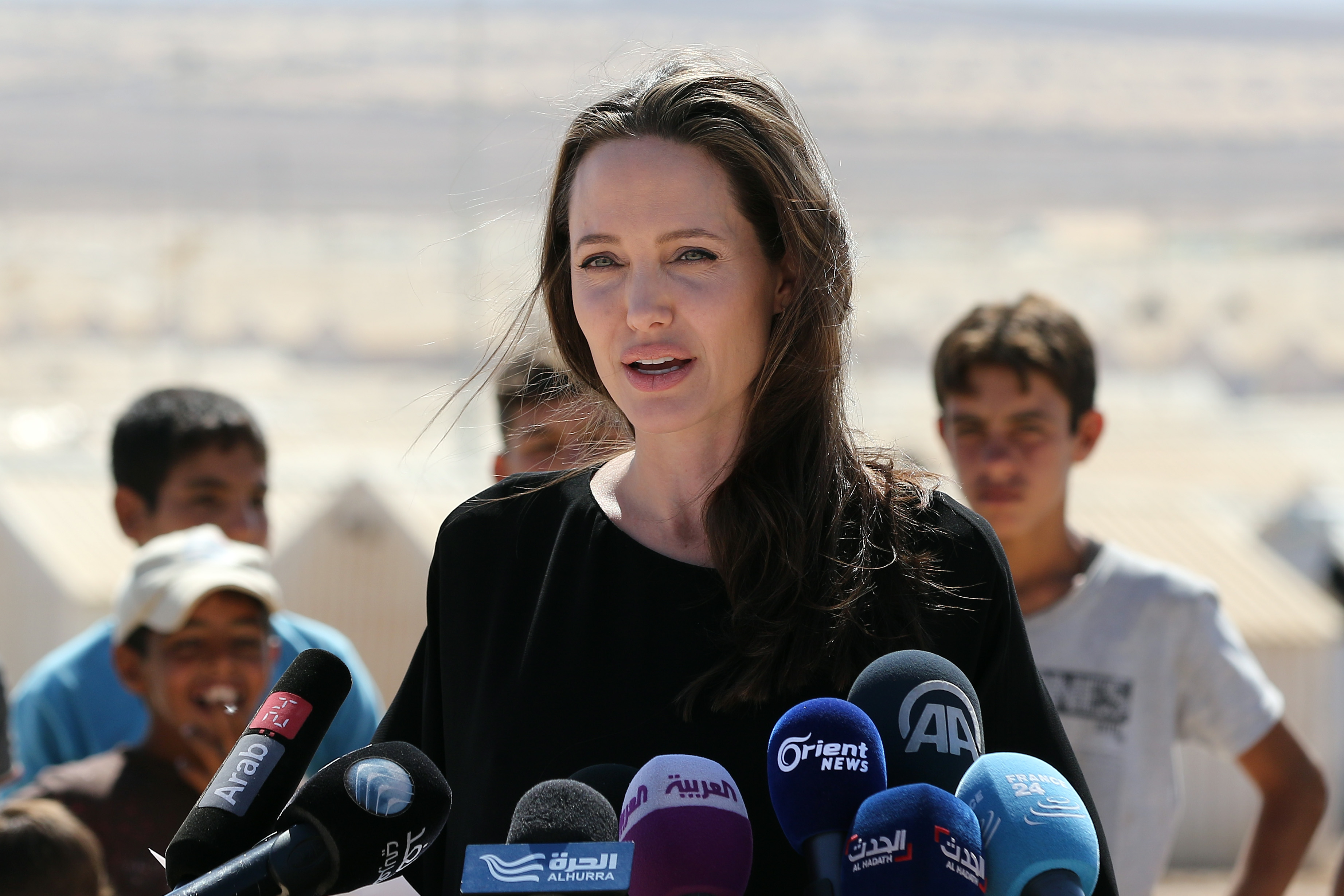 Actress and UNHCR special envoy Angelina Jolie talks during a visit to a Syrian refugee camp in Azraq in northern Jordan, on Sept. 9, 2016. (Khalil Mazraawi—AFP/Getty Images)