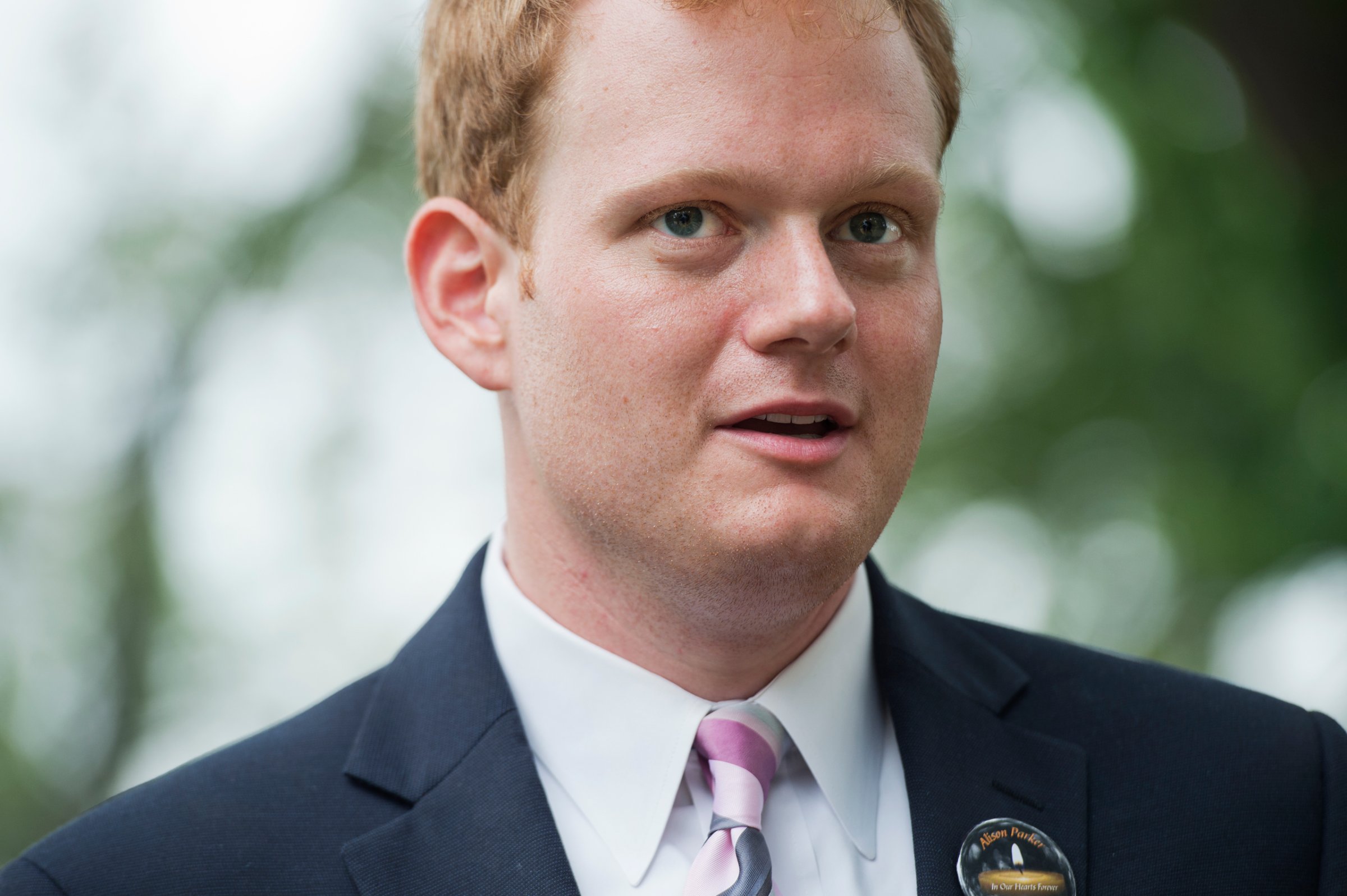UNITED STATES - SEPTEMBER 10: Chris Hurst, whose girlfriend Alison Parker, a reporter for WDBJ-TV reporter, was killed on air last month, greets Gov. Terry McAuliffe, D-Va., during a rally on the East Front lawn of the Capitol to demand that Congress take action on gun control legislation, September 10, 2015. The event, titled #Whateverittakes Day of Action, was hosted by Everytown for Gun Safety and featured speeches by political leaders and families of gun violence victims. (Photo By Tom Williams/CQ Roll Call)