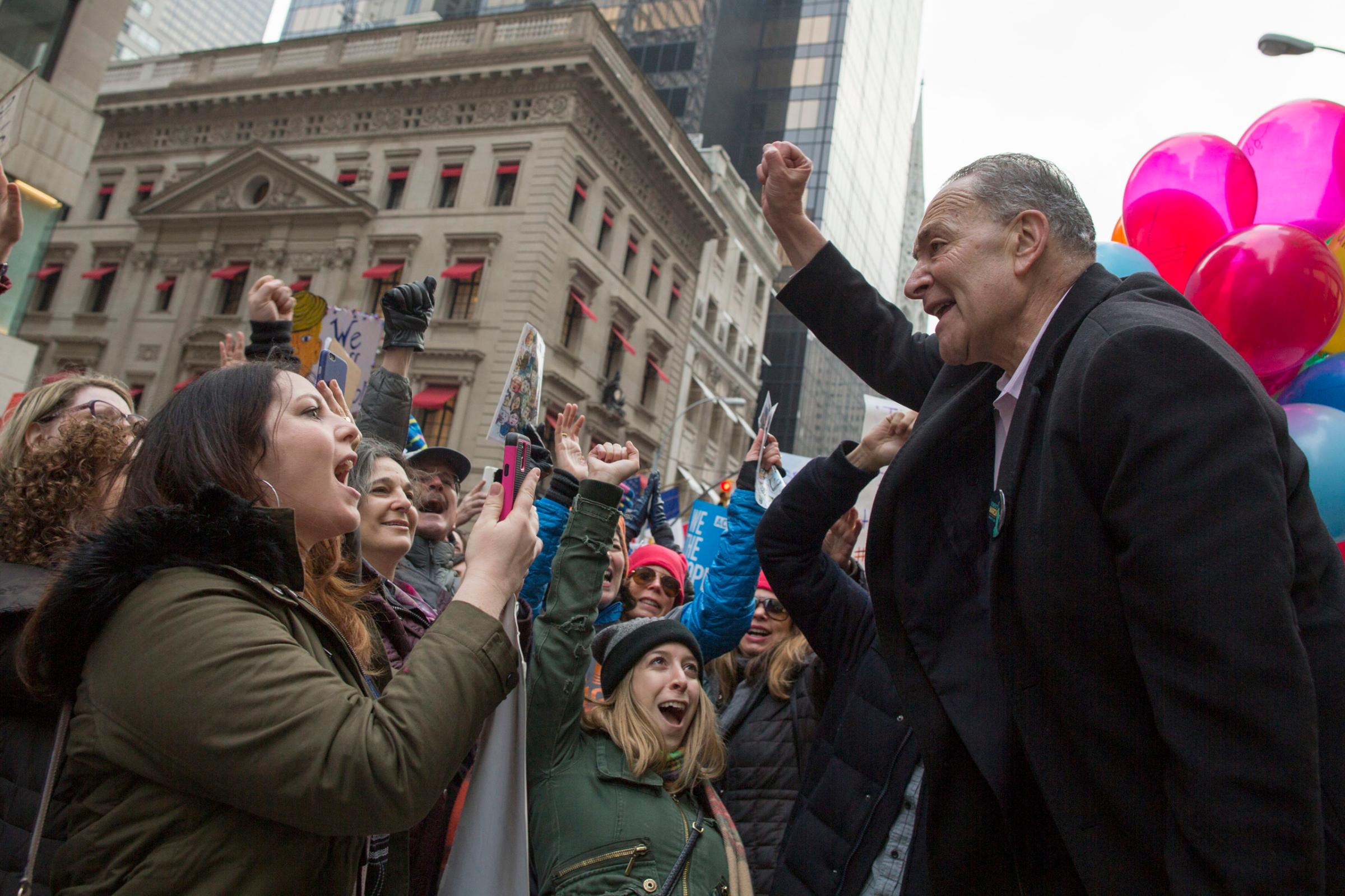 Schumer joins demonstrators marching up Fifth Avenue in New York during a women's march being held in solidarity with similar events taking place in Washington and around the nation, Jan. 21, 2017.