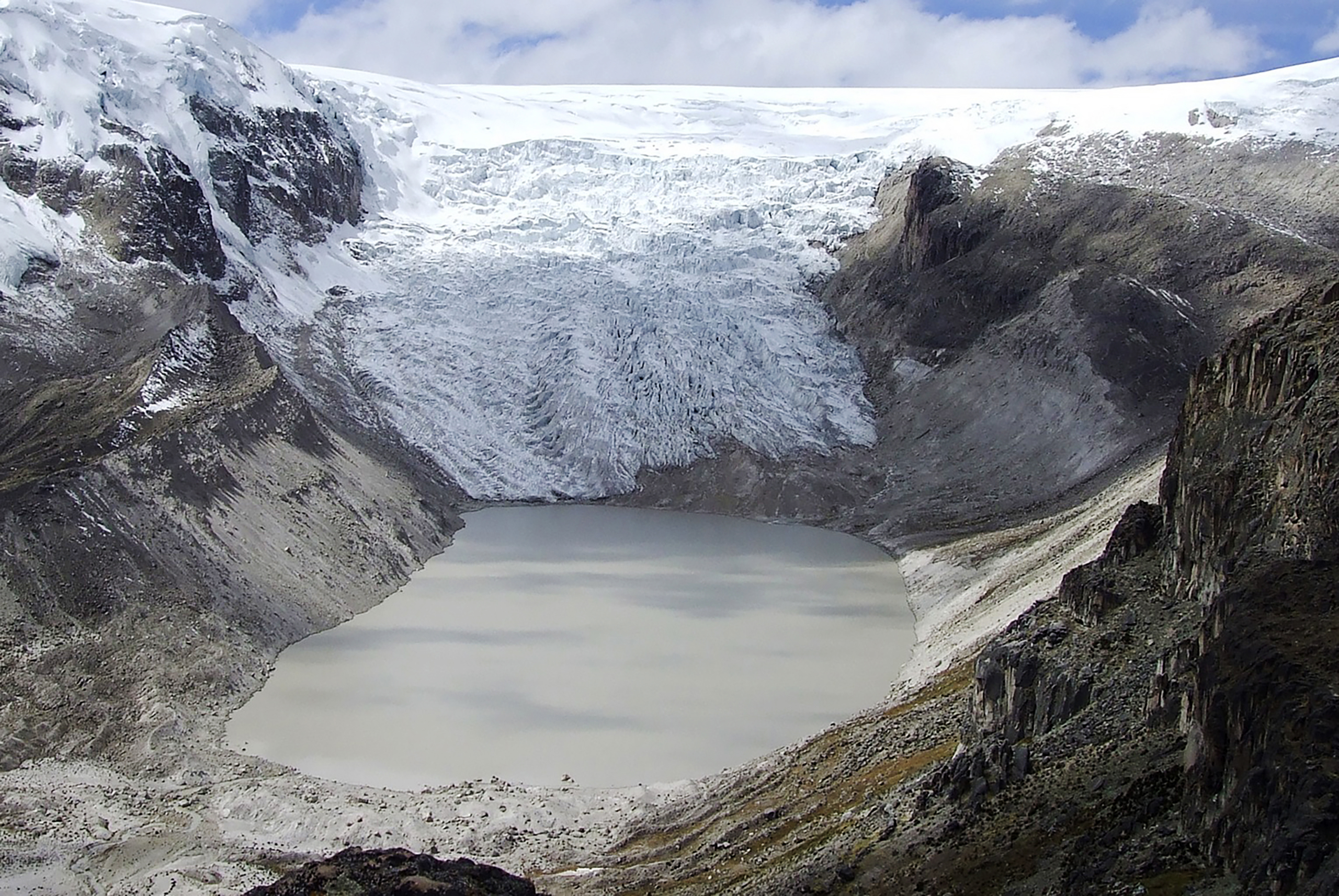NASA images show Qori Kalis (above), a glacier that is part of the world’s largest tropical ice cap, on a plateau 18,670 ft. (5,691 m) high in the Andes Mountains of Peru. In 1978, the glacier was still expanding. But not anymore. By 2011, it had retreated far enough to leave a lake 86 acres (35 hectares) in area and 200 ft. (60 m) deep. Human-influenced climate change has also contributed to the retreat of Muir and Riggs Glaciers (next pages), in Alaska. (Courtesy of NASA)