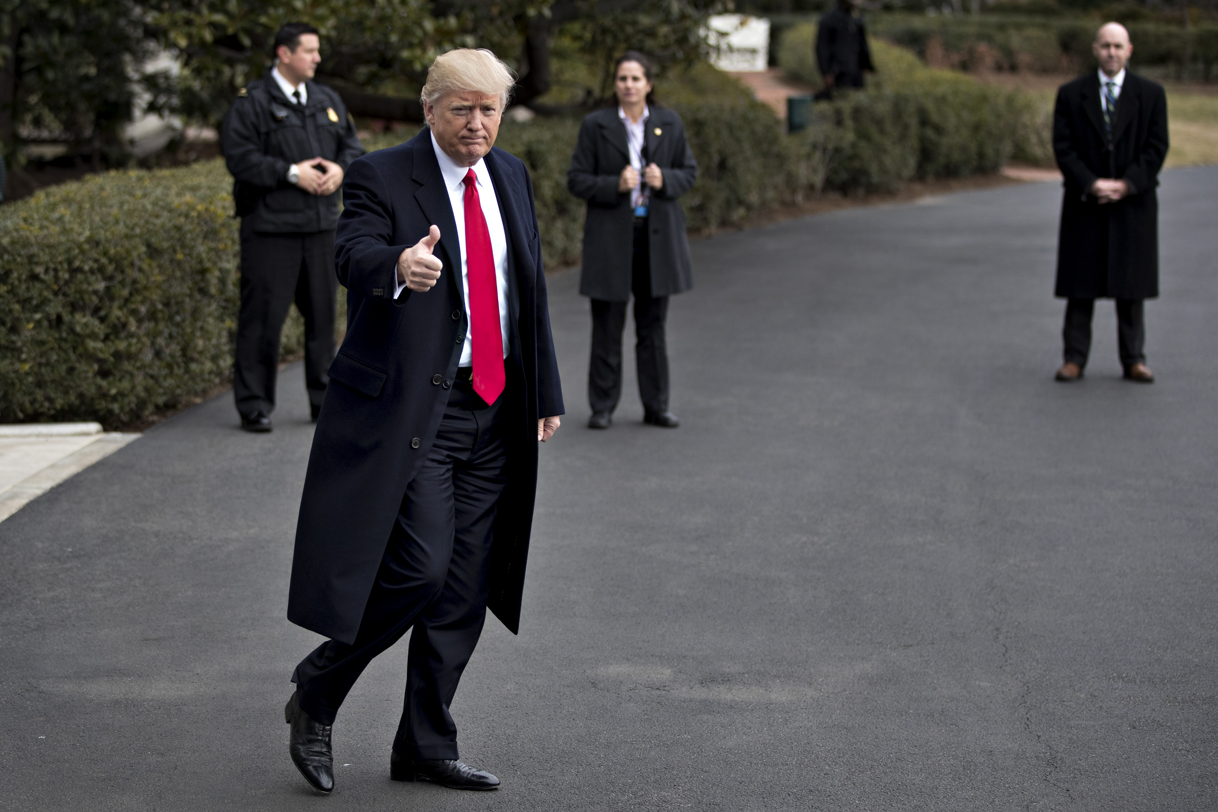 President Donald Trump gestures toward members of the media as he walks out of the White House to board Marine One in Washington, D.C., on Feb. 3, 2017. (Andrew Harrer—Bloomberg/Getty Images)