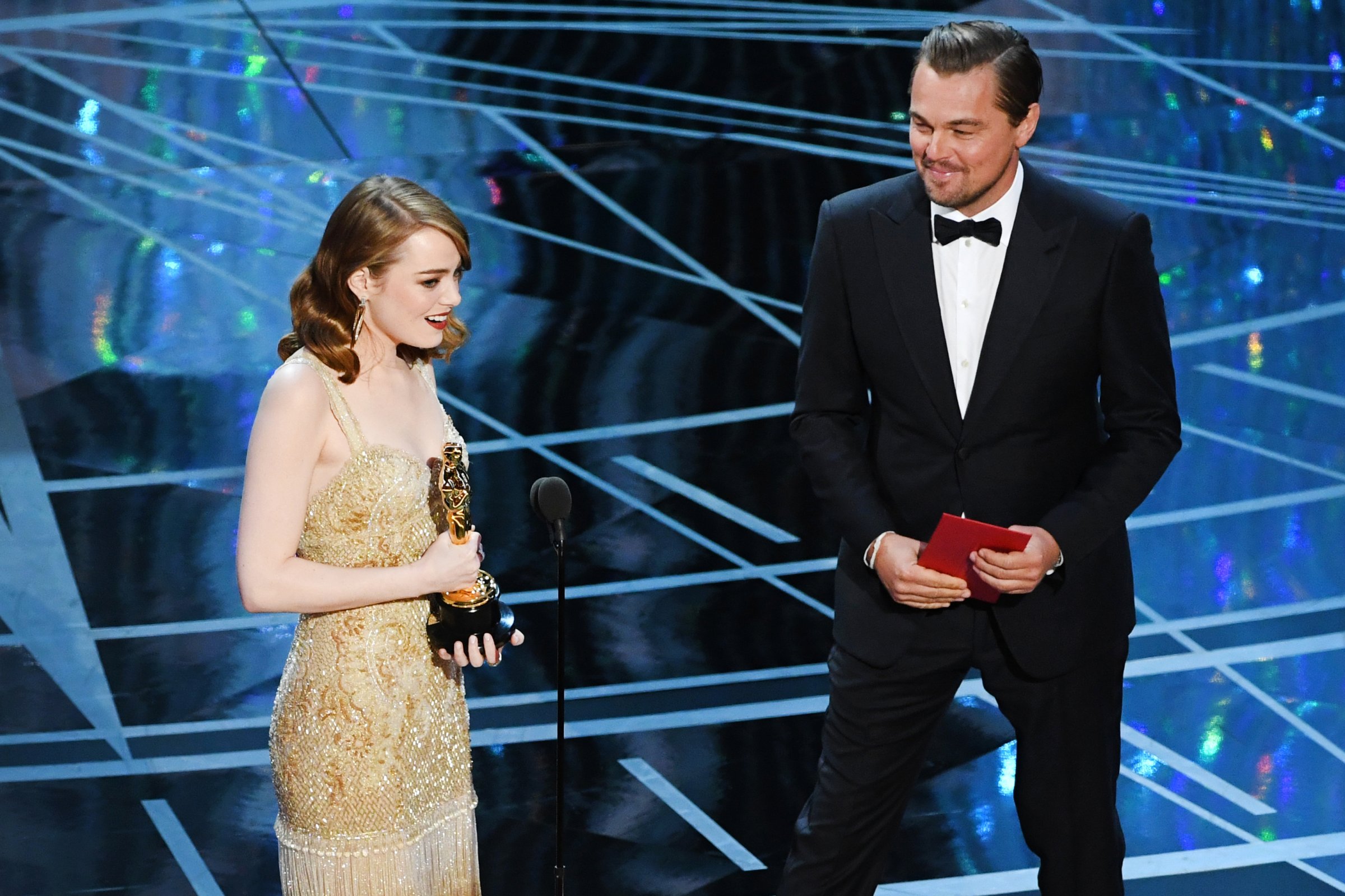 Emma Stone accepts Best Actress for La La Land from Leonardo DiCaprio during the 89th Annual Academy Awards, on Feb. 26, 2017 in Hollywood, Calif.
