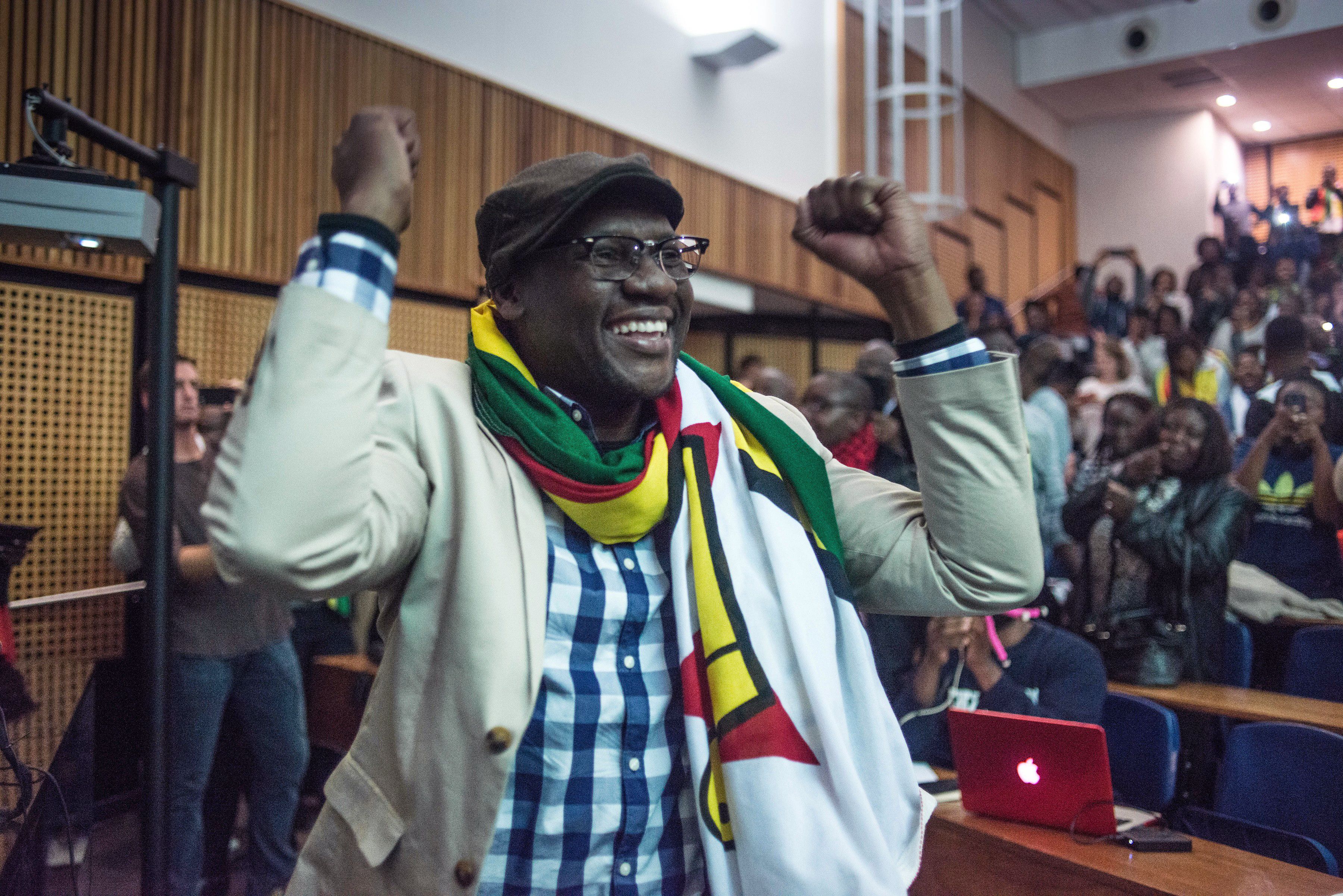 Zimbabwean Pastor Evan Mawarire gestures after addressing students during a lecture at Wits University in Johannesburg, on July 28, 2016. (Mujahid Safodien—AFP/Getty Images)