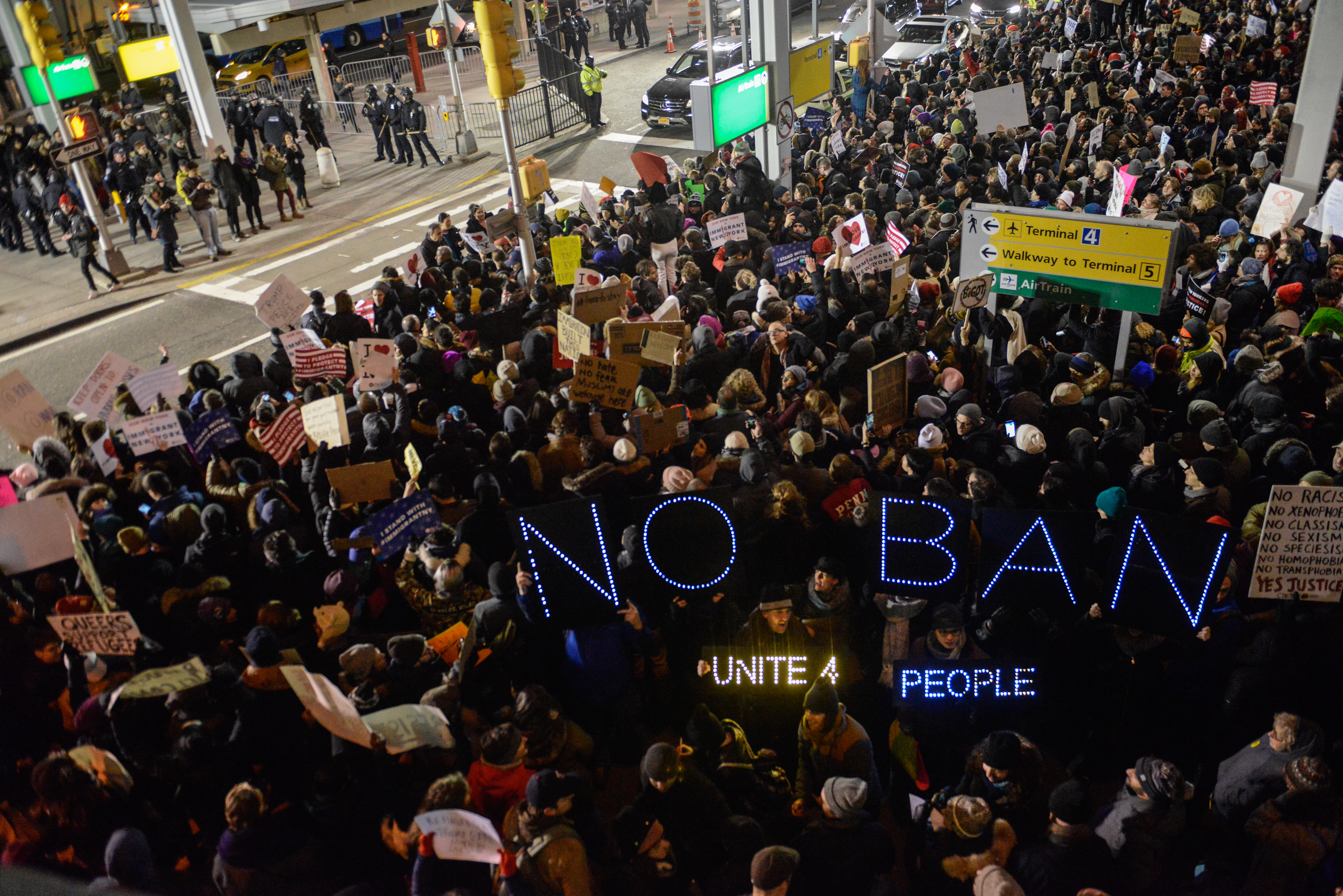 Protestors rally  during a demonstration against the immigration ban at John F. Kennedy International Airport on January 28, 2017 in New York City. (Stephanie Keith—Getty Images)