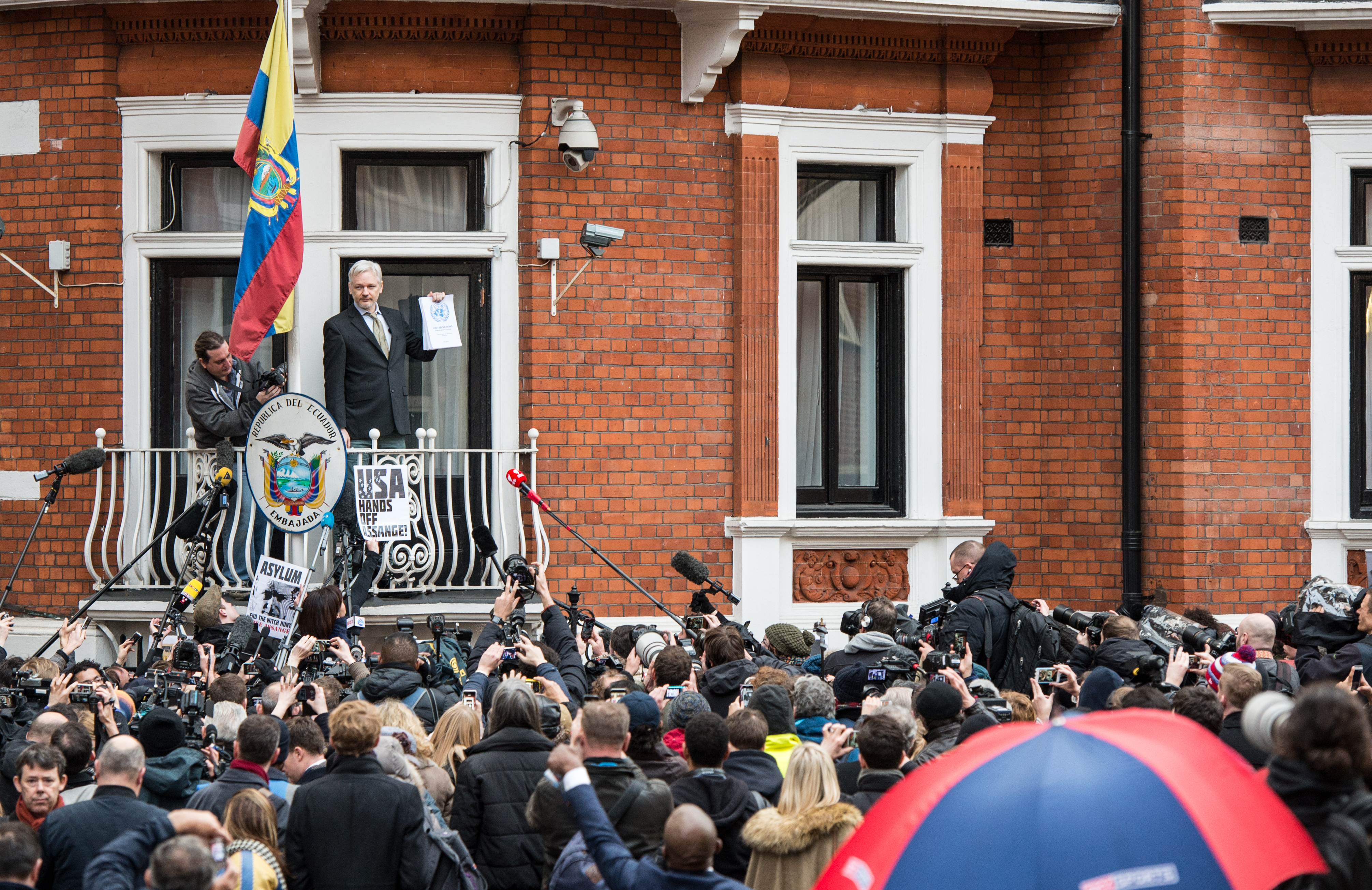 Wikileaks founder Julian Assange speaks from the balcony of the Ecuadorian embassy where  he continues to seek asylum following an extradition request from Sweden, on February 5, 2016 in London. (Chris Ratcliffe—Getty Images)