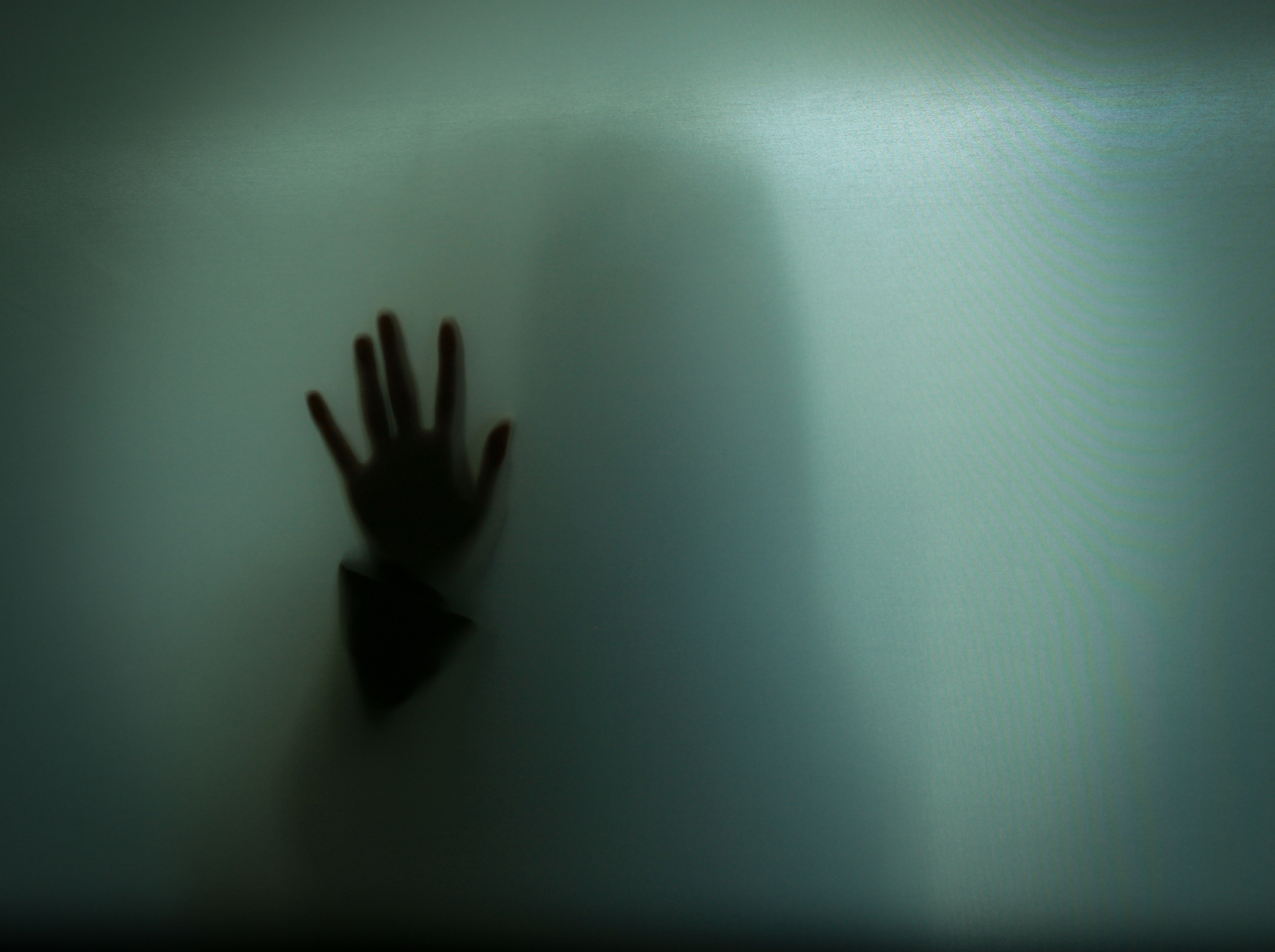 Hand Shadow Of Woman On Glass
