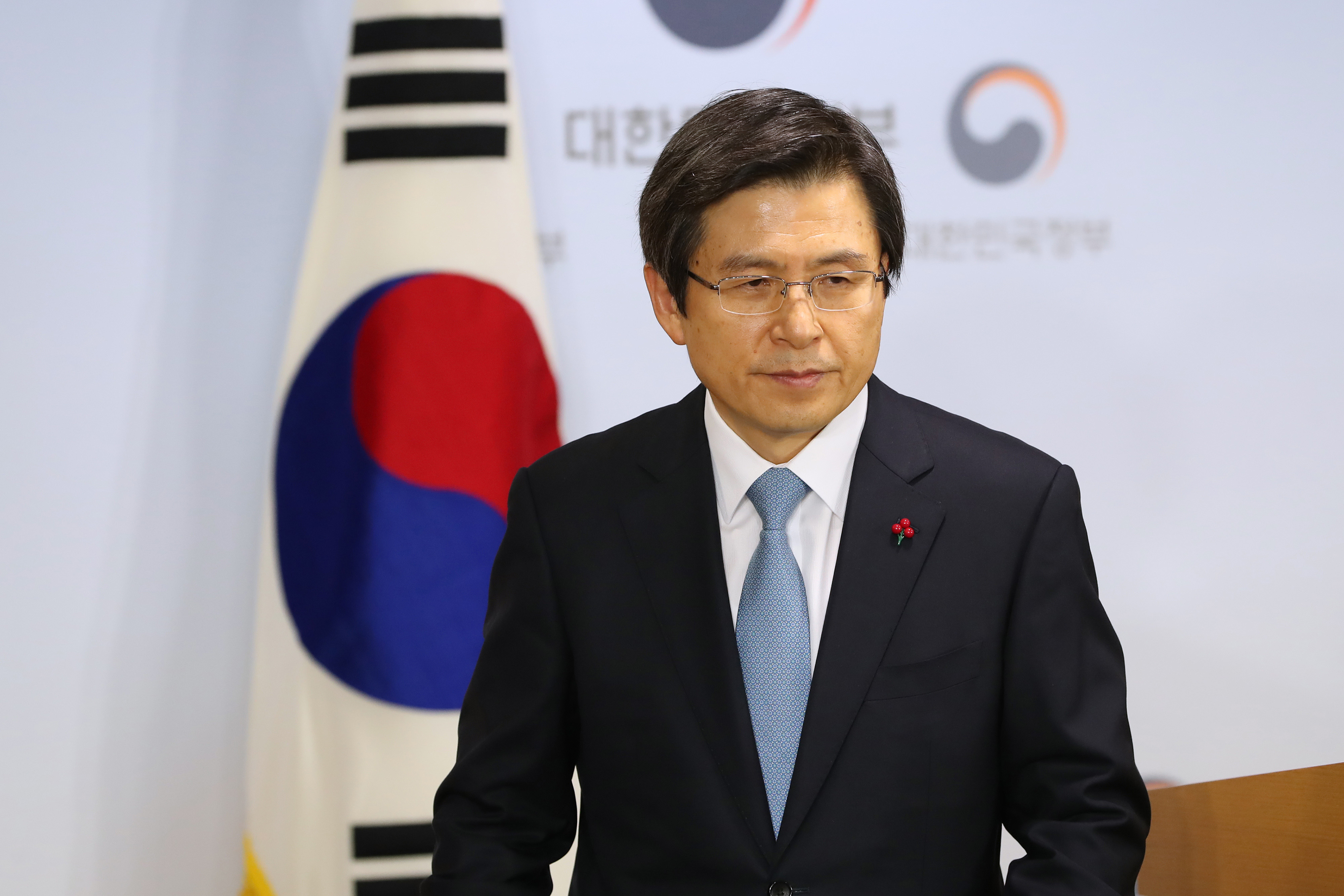 Hwang Kyo-ahn, South Korea's prime minister, departs a news conference in Seoul, South Korea, on Friday, Dec. 9, 2016. (SeongJoon Cho—Bloomberg via Getty Images)
