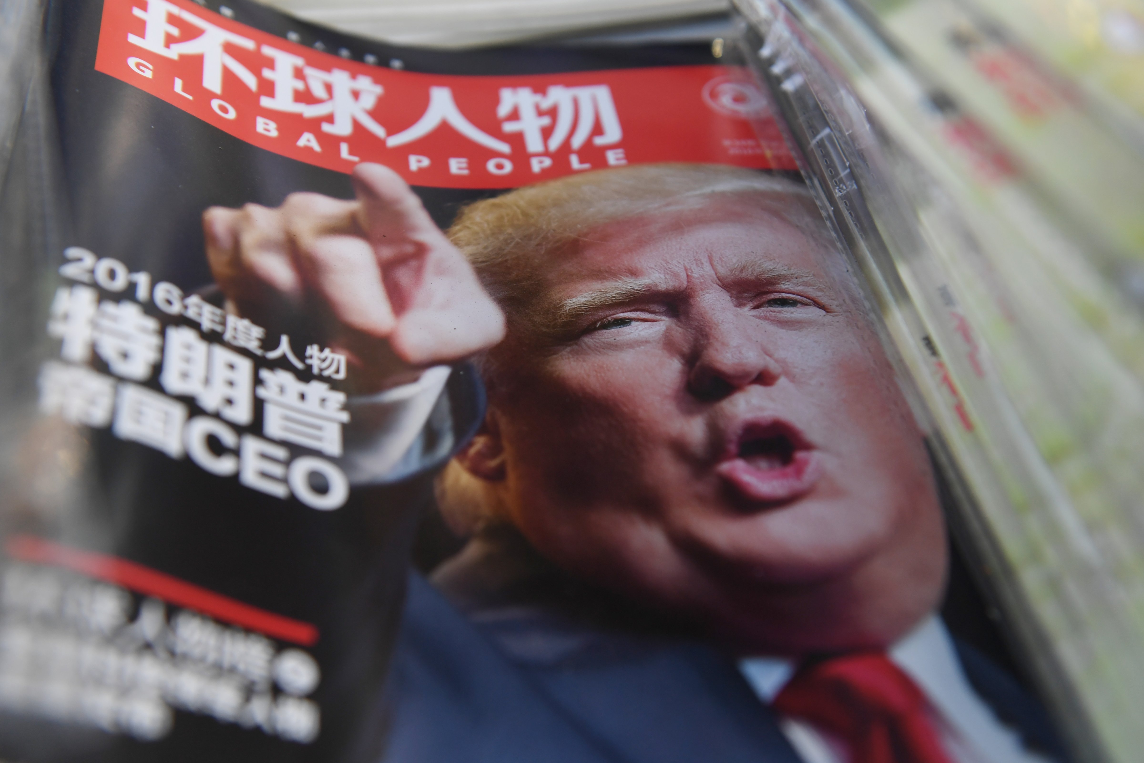 A Chinese magazine with a cover story naming then-President-elect Donald Trump their Person of the Year for 2016. (Greg Baker—AFP/Getty Images)