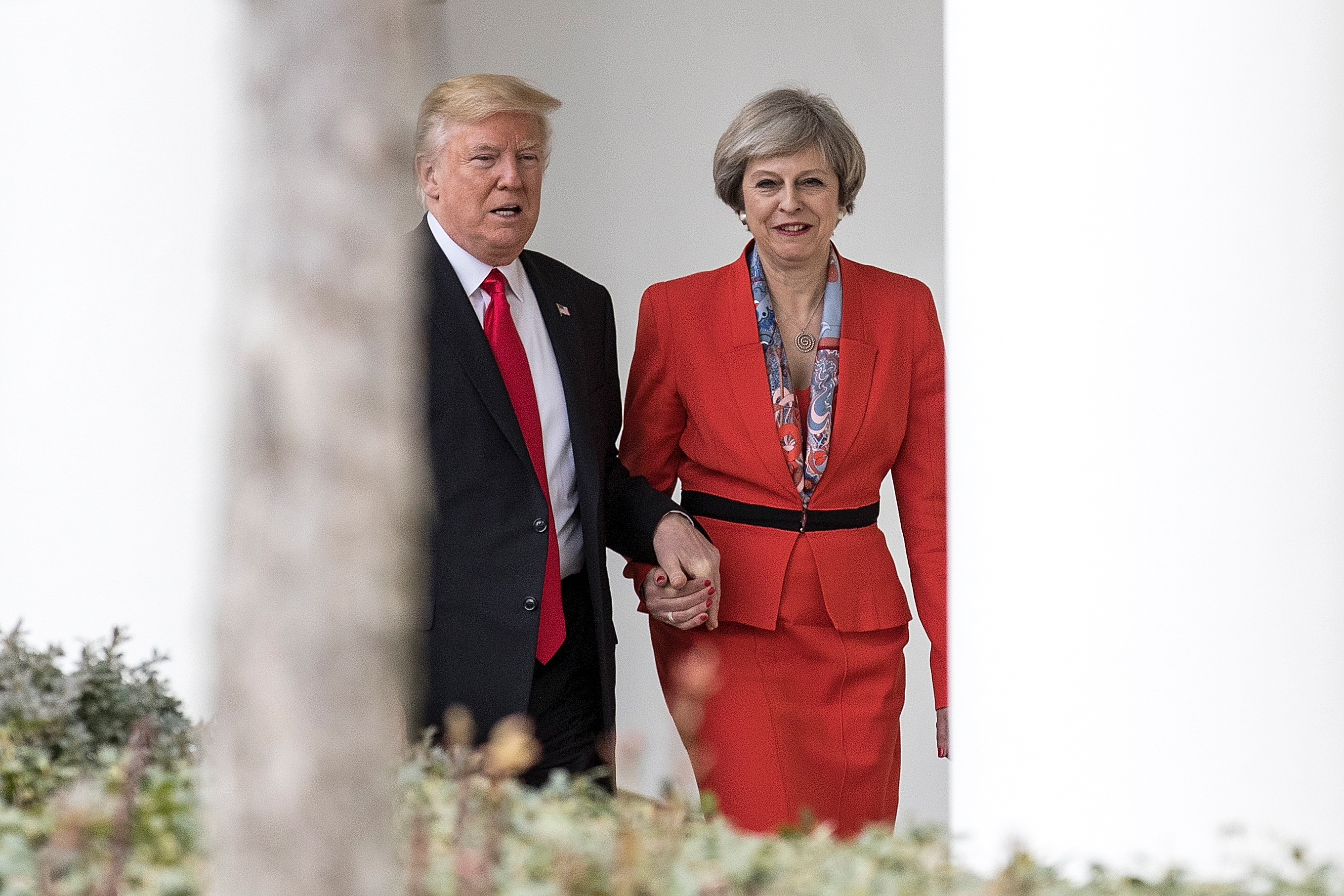 British Prime Minister Theresa May and U.S. President Donald Trump walk along The Colonnade of the West Wing at The White House on January 27, 2017 in Washington, DC. (Christopher Furlong—Getty Images)