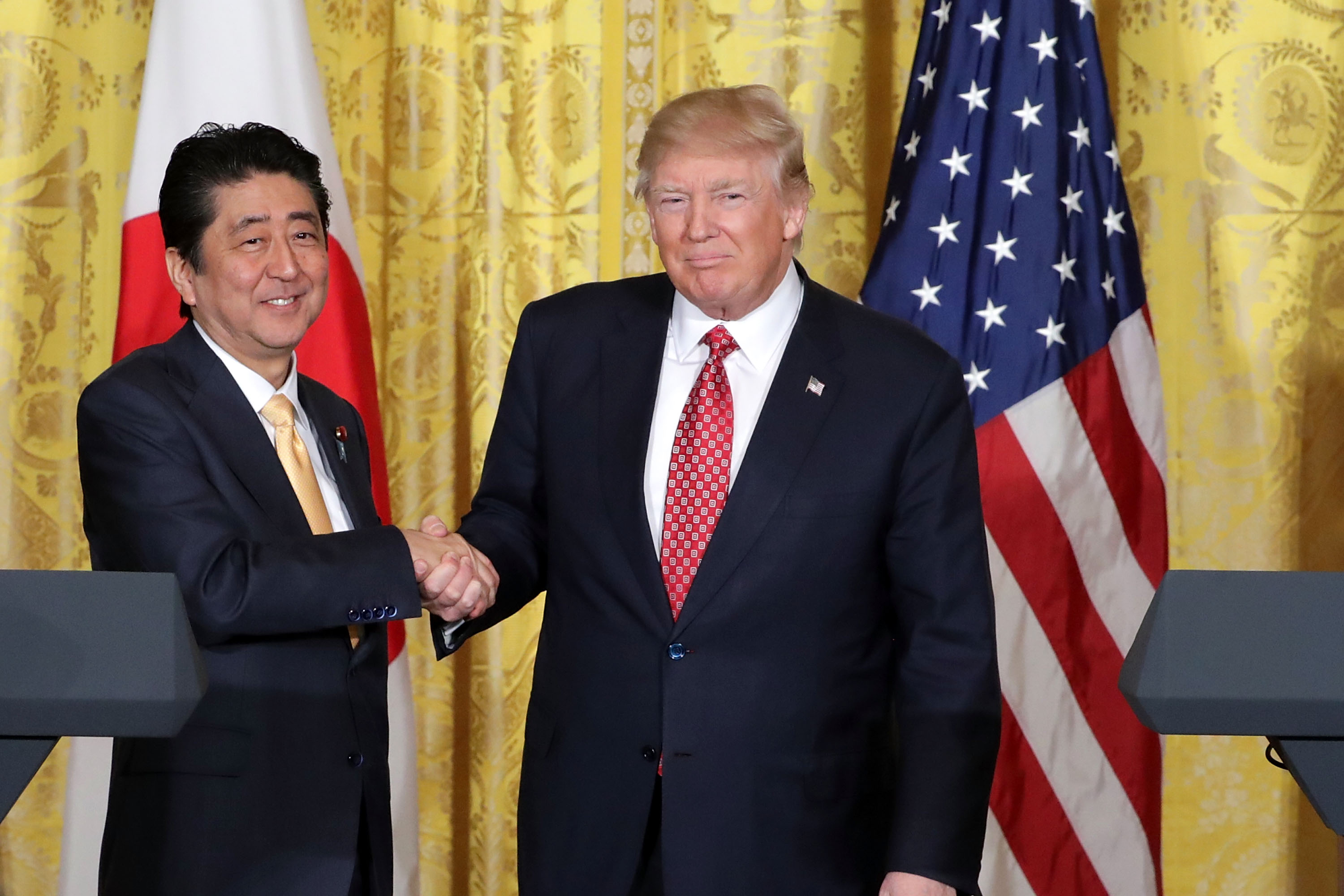 U.S. President Donald Trump and Japanese Prime Minister Shinzo Abe shake hands at the conclusion of a joint news conference in the East Room at the White House February 10, 2017 in Washington, DC. (Chip Somodevilla—Getty Images)