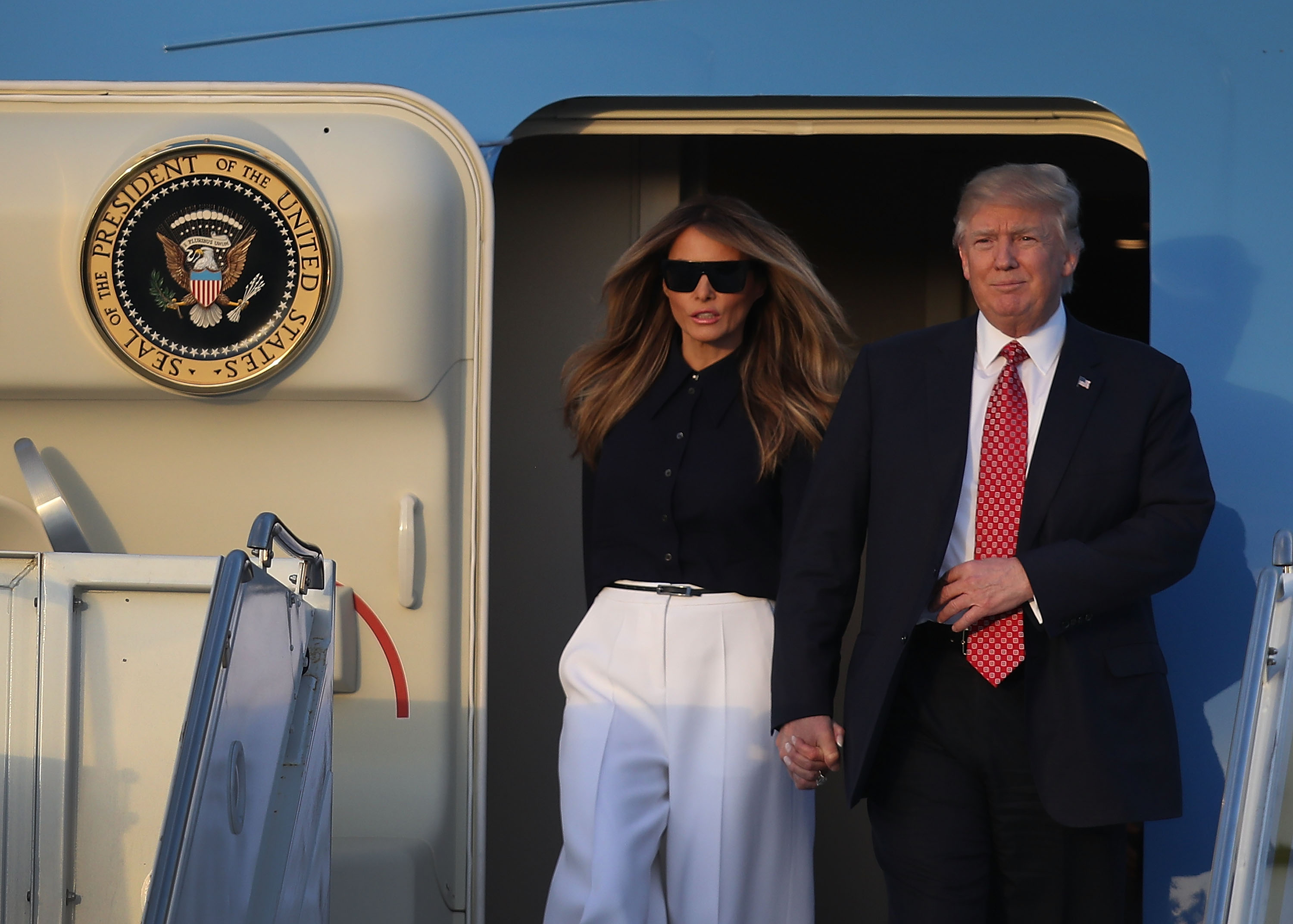 President Donald Trump and his wife Melania Trump arrive on Air Force One at the Palm Beach International airport as they prepare to spend part of the weekend with Japanese Prime Minister Shinzo Abe and his wife Akie Abe at Mar-a-Lago resort on February 10, 2017 in West Palm Beach, Florida. (Joe Raedle—Getty Images)