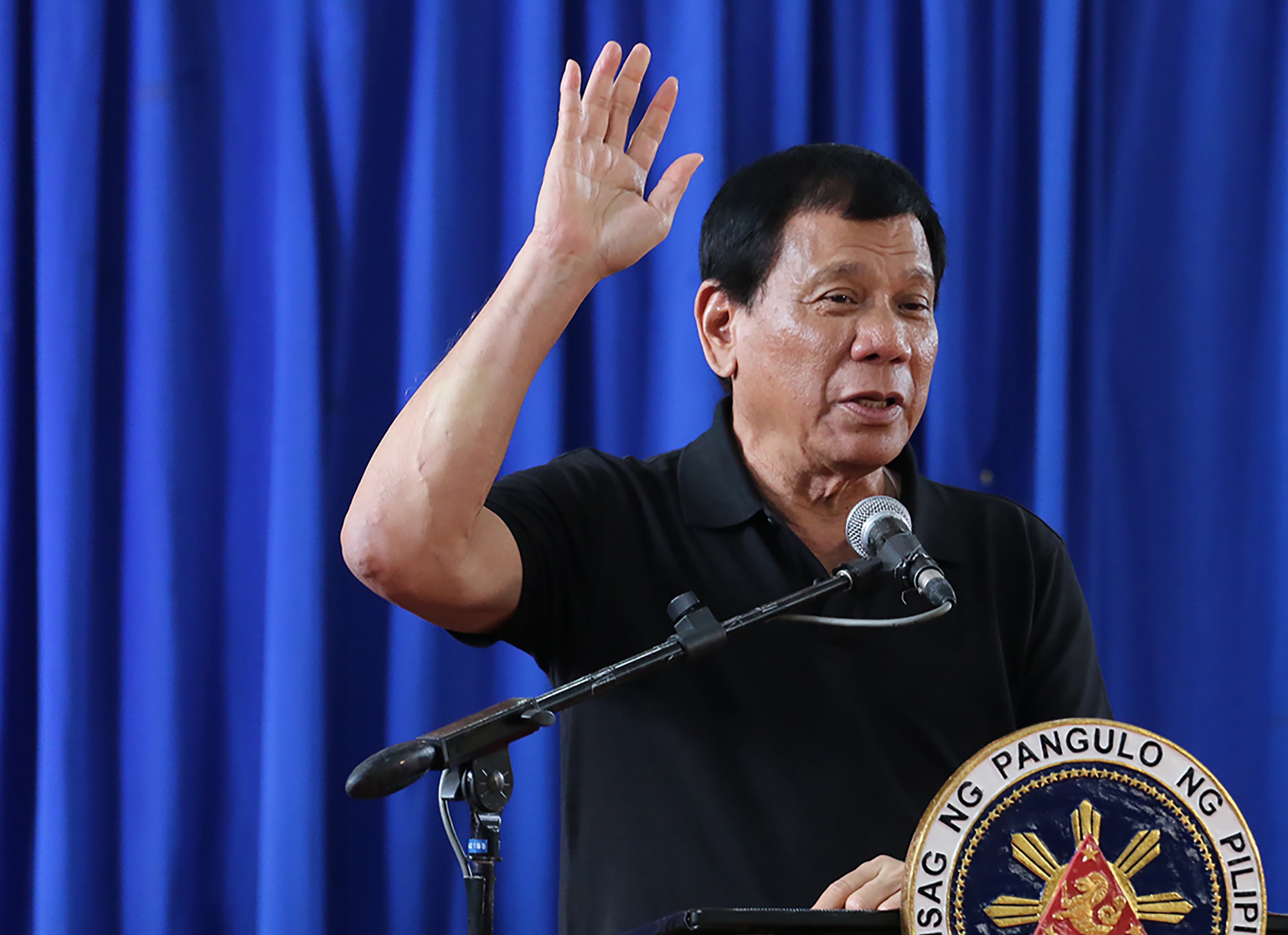 Philippine President Rodrigo Duterte gestures as he delivers his speech during a visit to earthquake victims in Surigao City in Mindanao, Feb. 12, 2017. (Erwin Mascarinas—AFP/Getty Images)