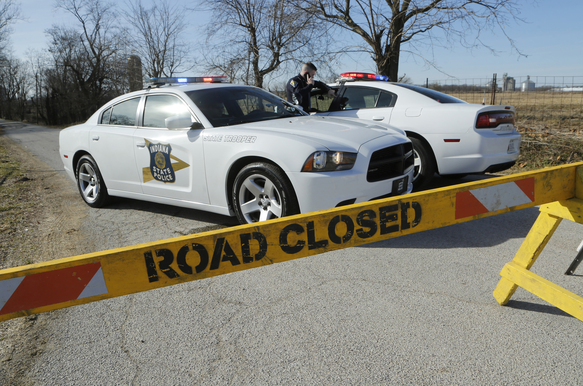 Police block the road near the intersection of Carroll County Roads North 575W and West 300N on Feb. 14, 2017, east of Delphi, Ind. (John Terhune—AP)