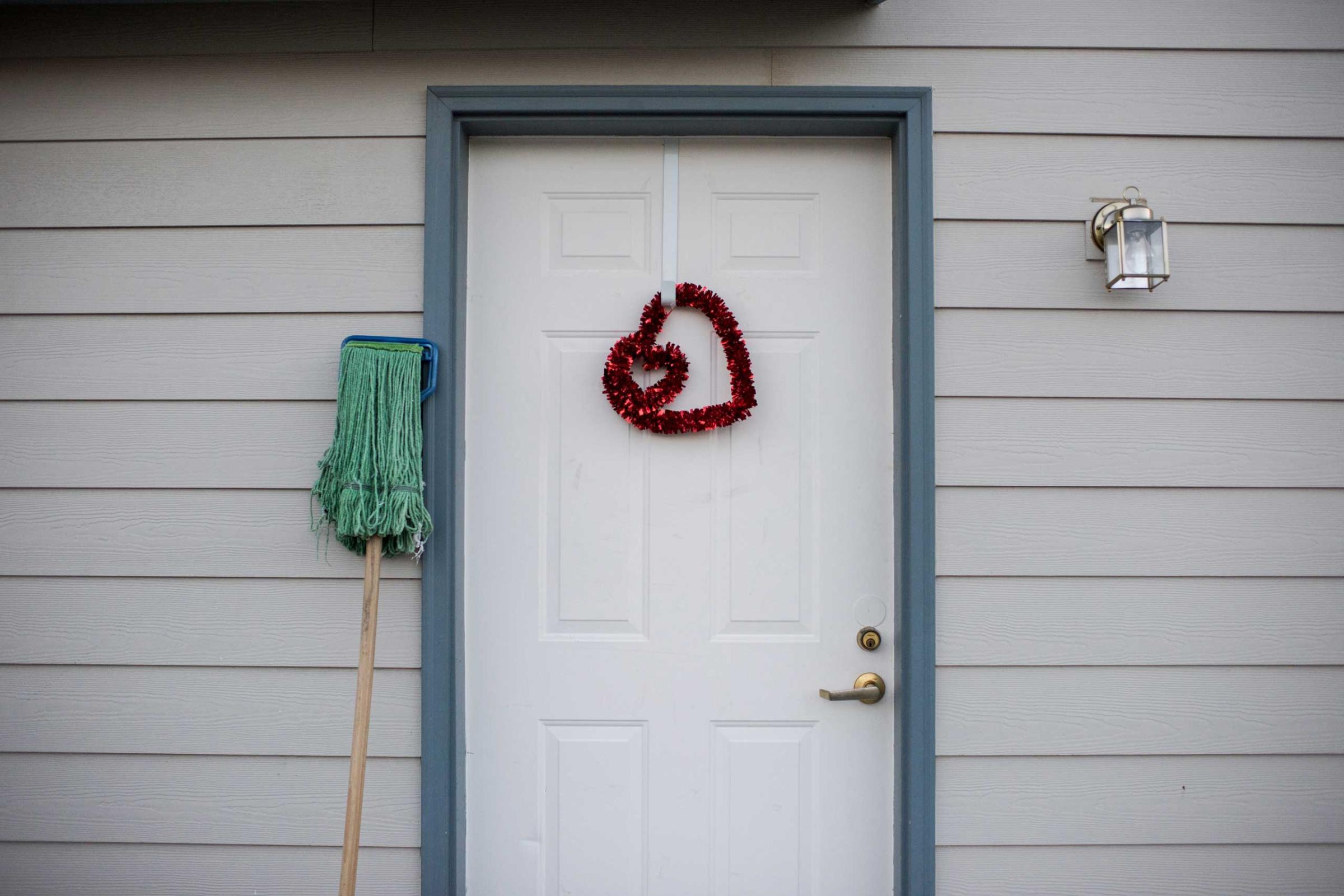 A heart shaped decoration hangs from the door of the house where Nathaniel resides.