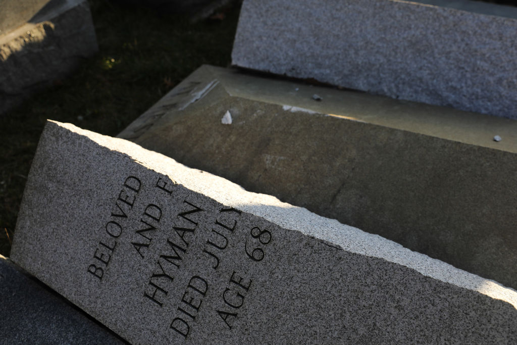 A vandalized tombstone is seen at the Jewish Mount Carmel Cemetery on Feb. 26, 2017 in Philadelphia, PA. (Dominick Reuter—AFP/Getty Images)