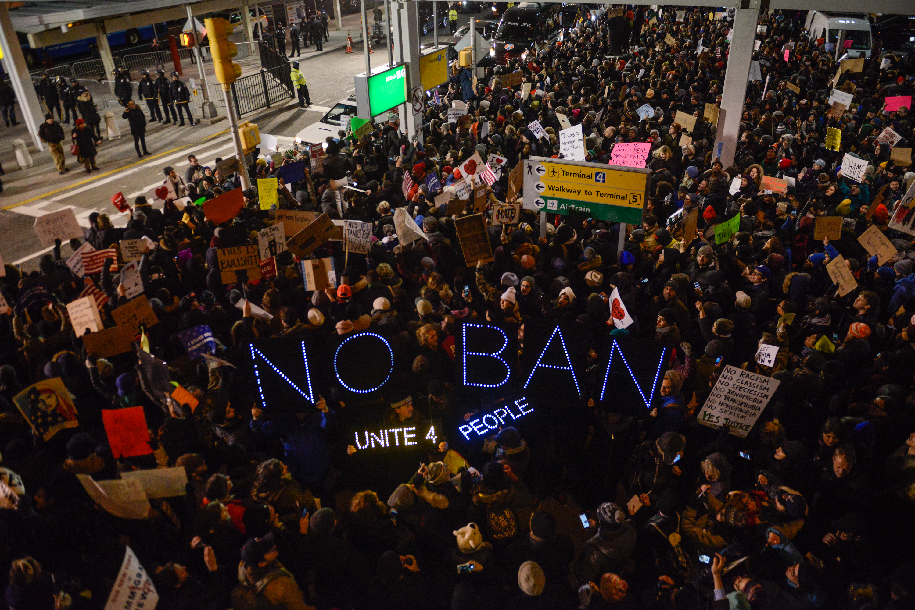 Protesters rally during a demonstration against the Muslim immigration ban at JFK International Airport on Jan. 28, 2017, in New York City (Stephanie Keith—Getty Images)
