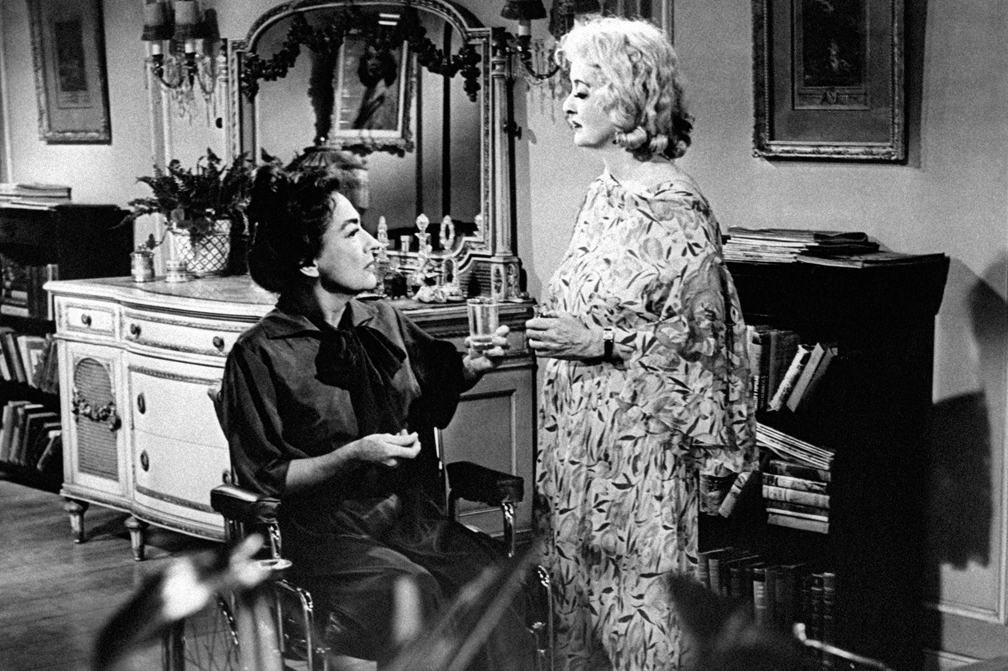 Joan Crawford and Bette Davis chatting
