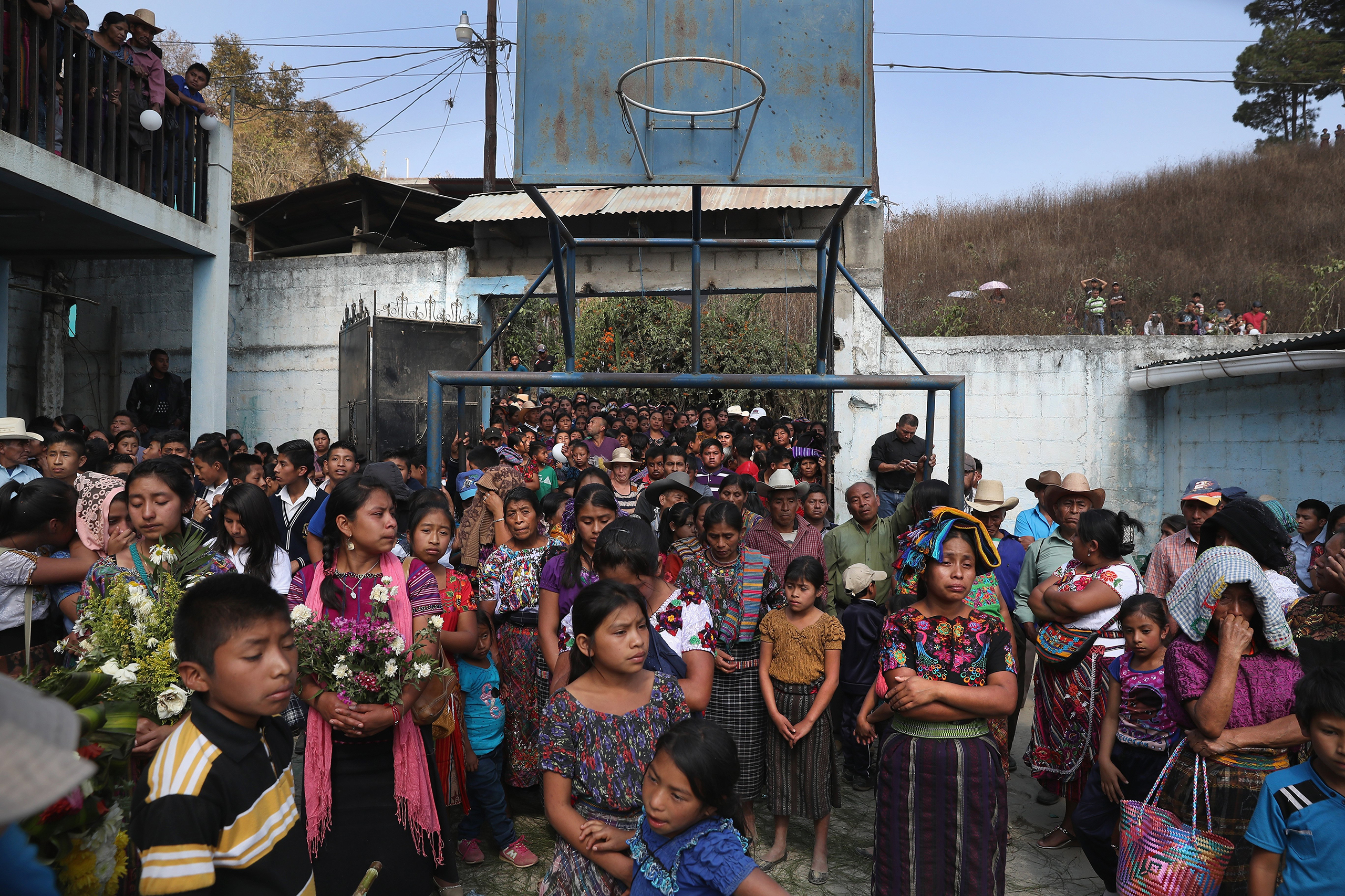 Villagers attend a memorial service held at the elementary school attended by two boys who were kidnapped and killed in San Juan Sacatepéquez on Feb. 14, 2017.