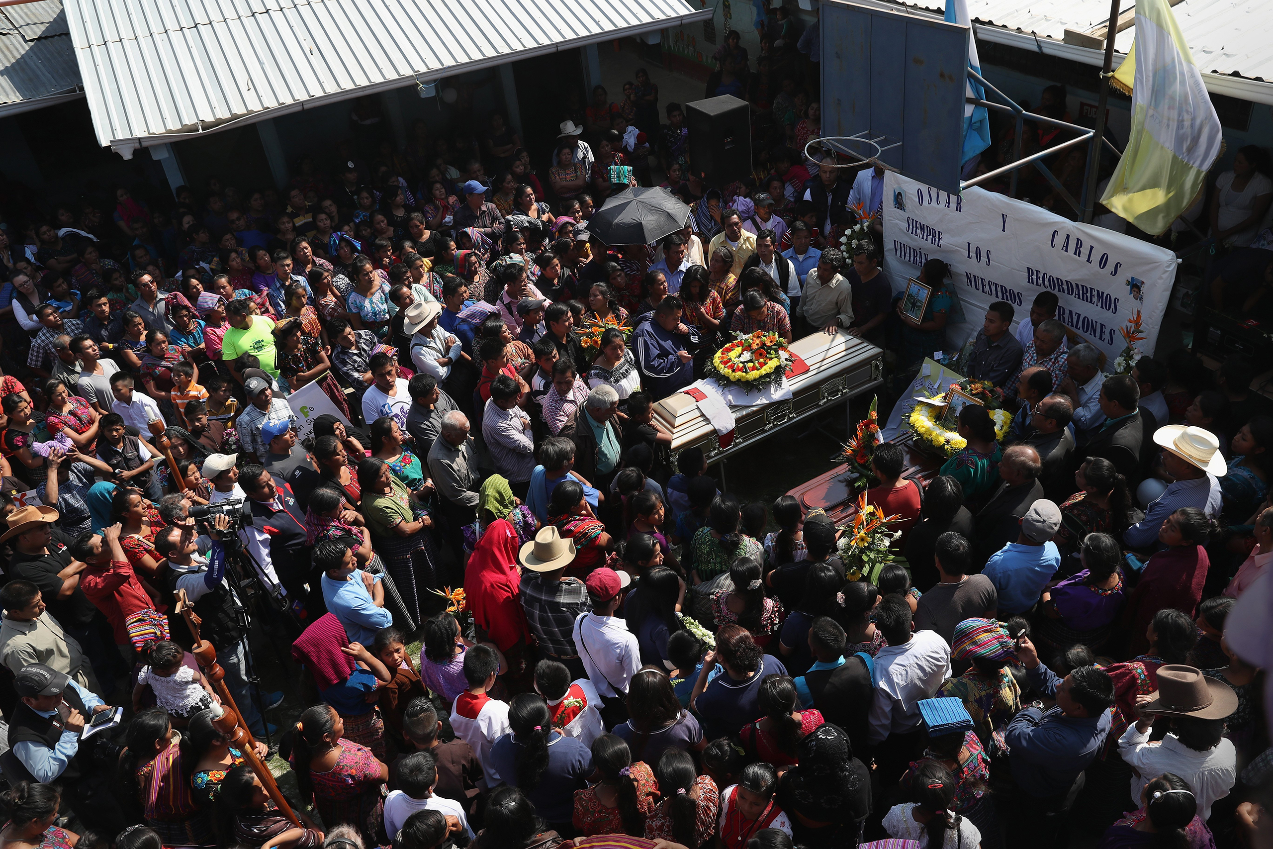 Villagers attend a memorial service held at the elementary school attended by two boys who were kidnapped and killed in San Juan Sacatepéquez on Feb. 14, 2017.