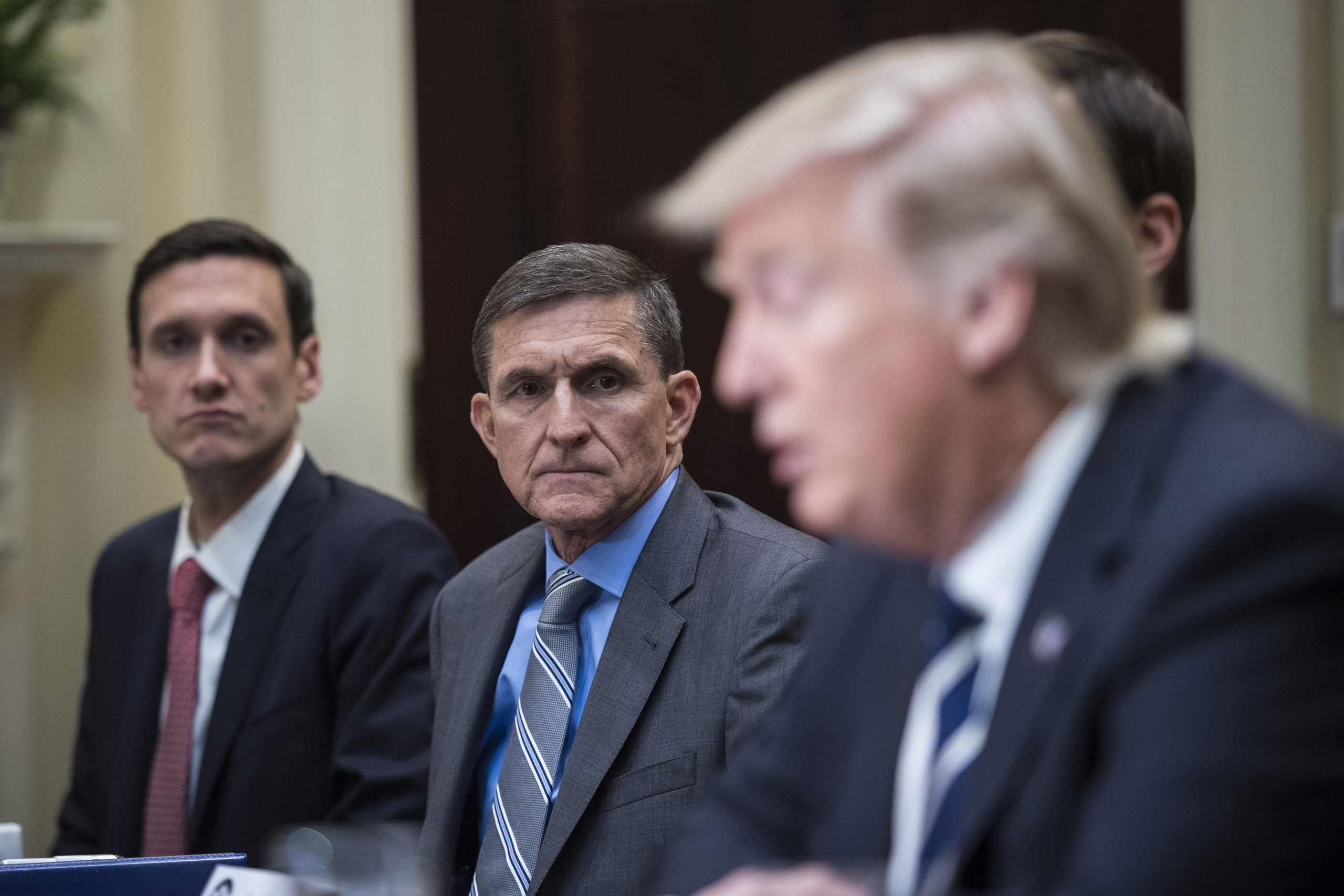 National Security Adviser Mike Flynn listens to President Trump during a listening session with cyber security experts in the Roosevelt Room of the White House in Washington, DC on Jan. 31, 2017. (Jabin Botsford—The Washington Post/Getty Images)