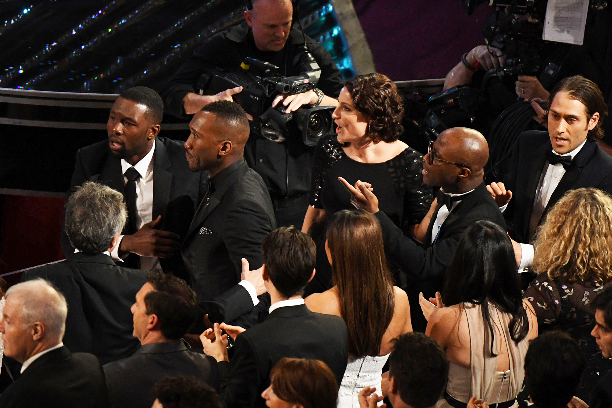The cast and crew of Moonlight react after they won the Best Picture Oscar, on Feb. 26, 2017 in Hollywood, Calif.