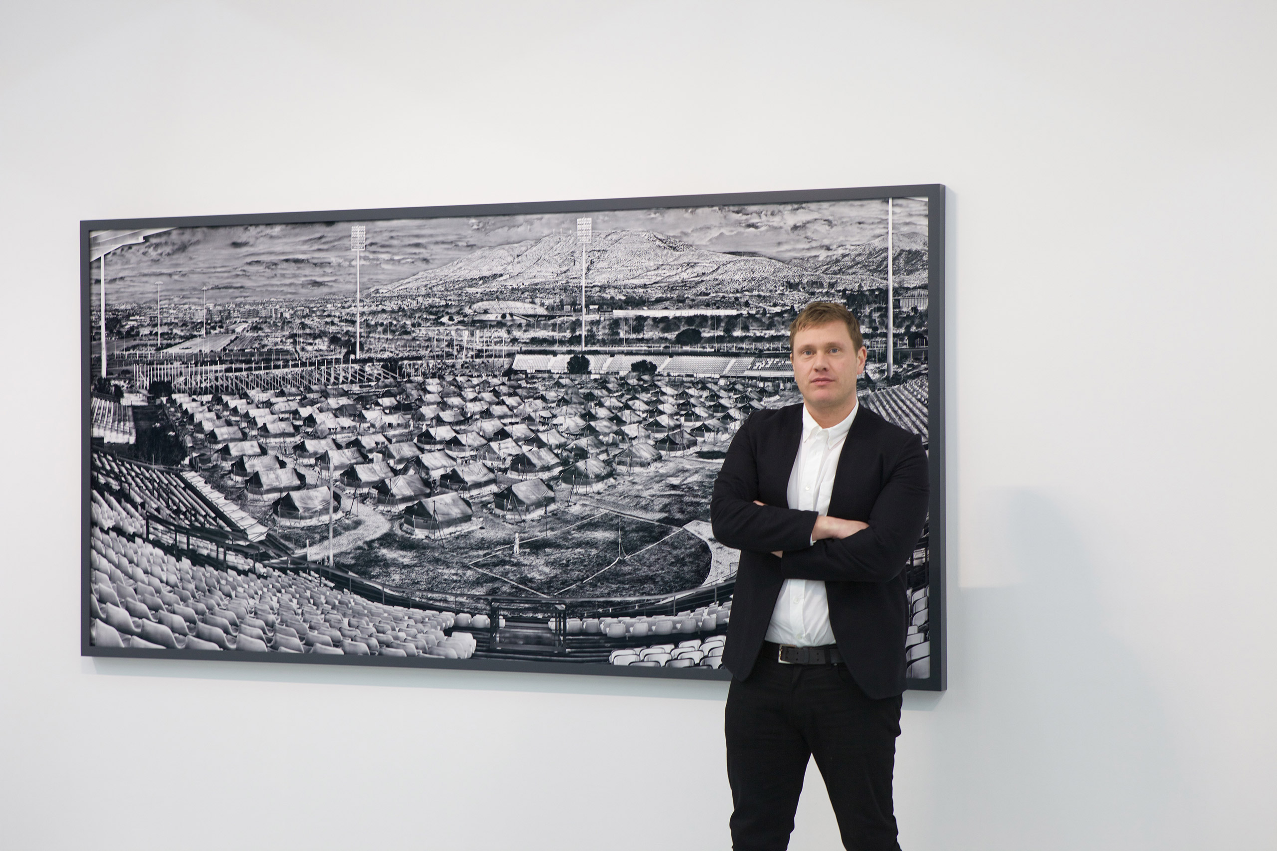 Richard Mosse stands in front of the work <i>Helliniko,</i> 2016, at the Jack Shainman Gallery, West 20, NYC. (Alexandra Genova)