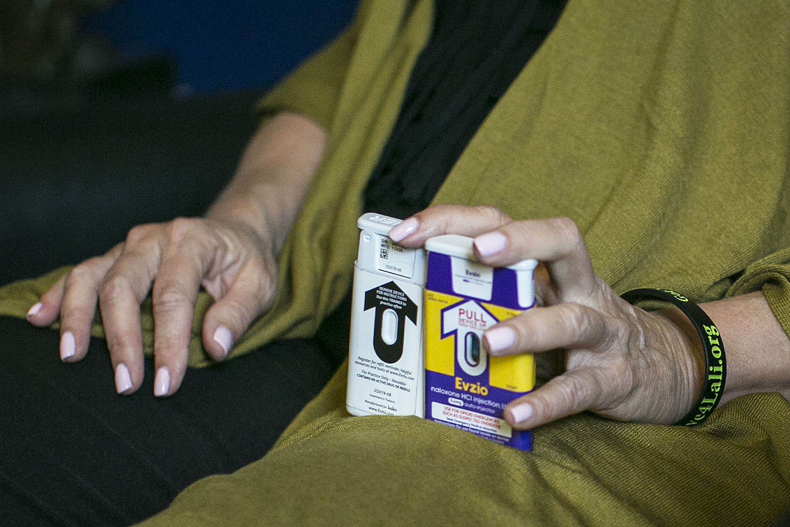 Jody Daitchman holds two versions of Naloxone, also known as Narcan, which combat drug overdoses, in Washington, on May 11, 2016. (Al Drago—CQ-Roll/Getty Images)