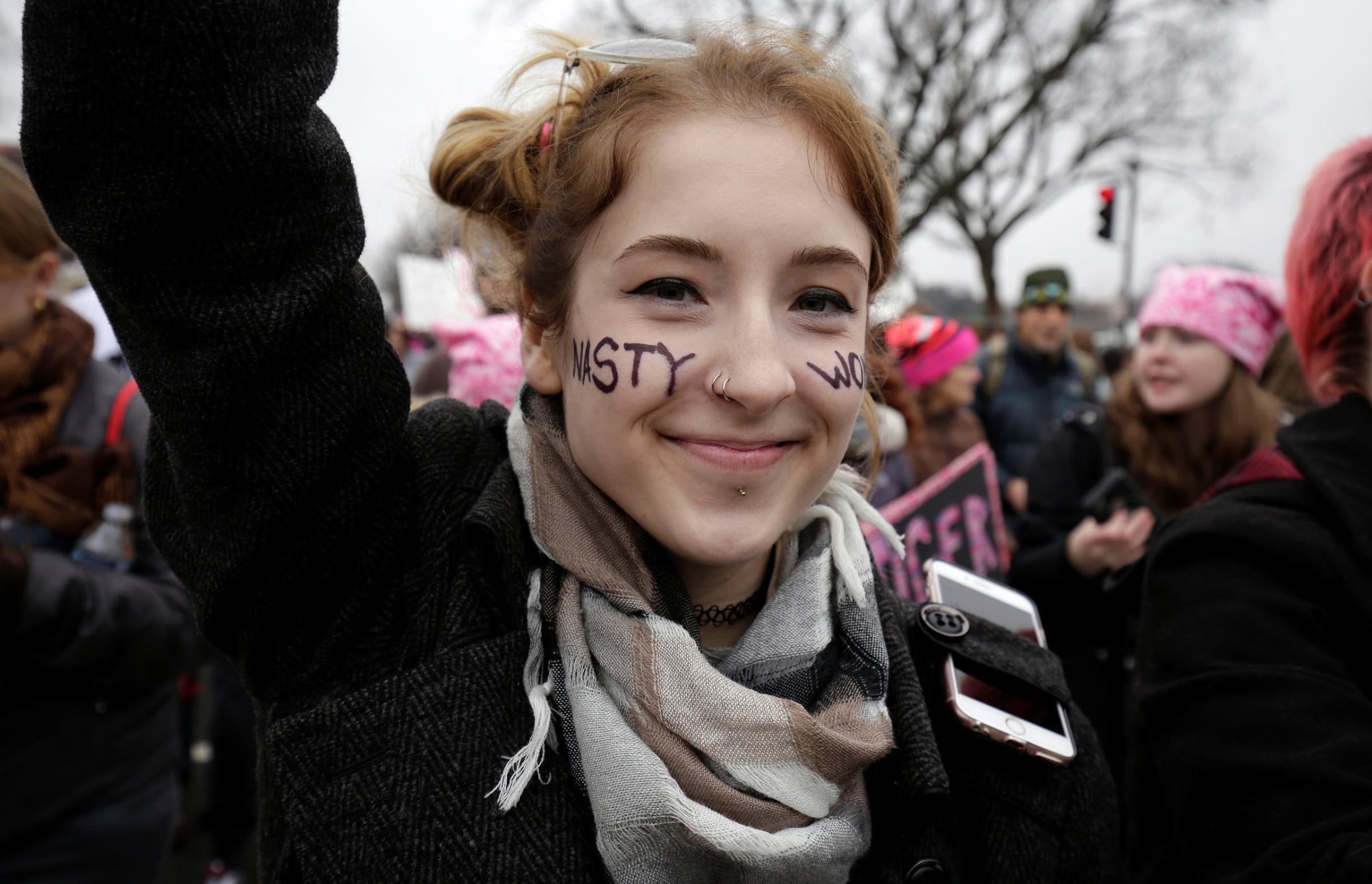 A protester wears "Nasty Woman" on her face during the Women‚Äôs March on Washington in reaction to U.S. President Donald Trump's inauguration in Washington.