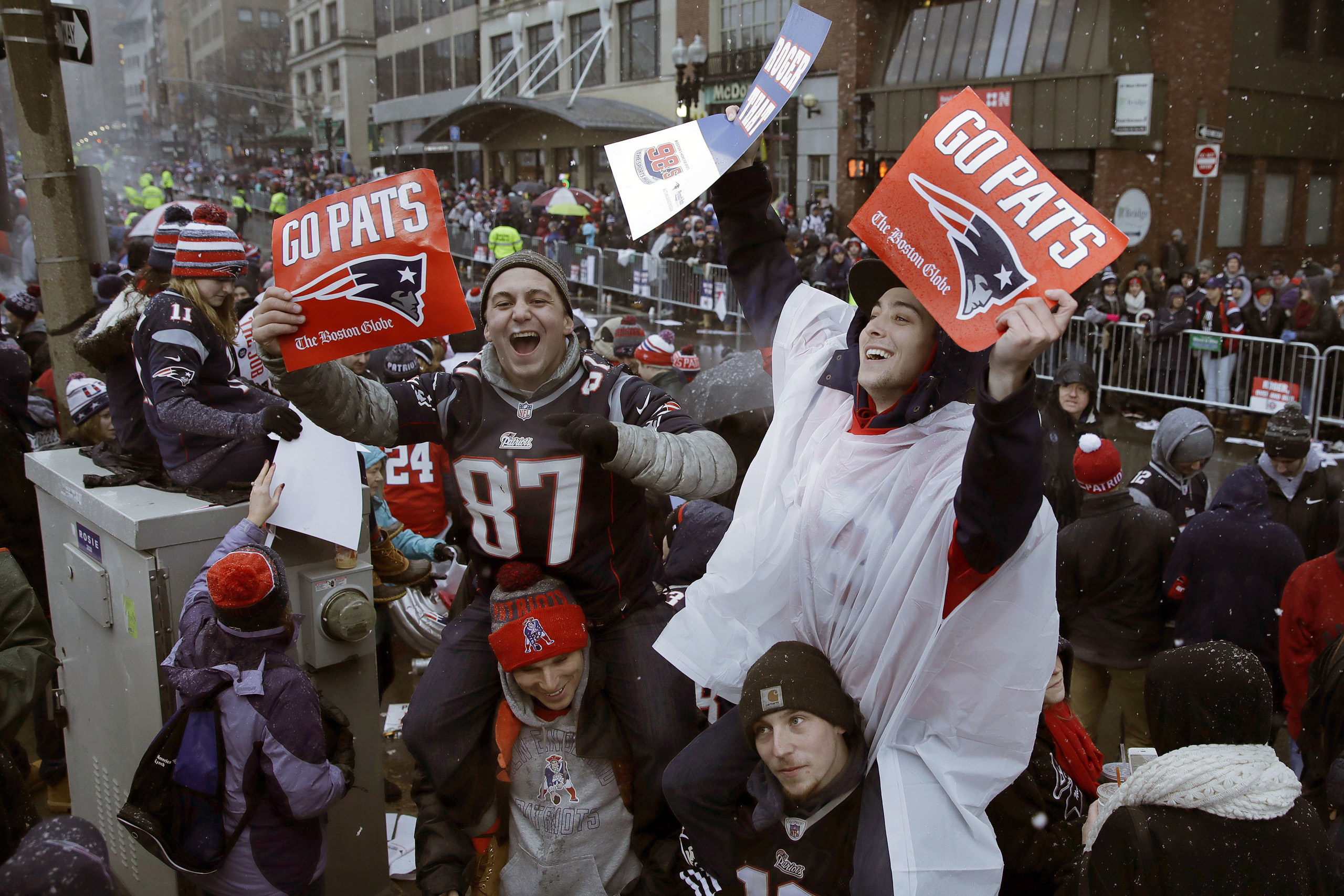 New England Patriots fans wait for the start of a parade in Boston to celebrate their team's 34-28 win over the Atlanta Falcons in Sunday's NFL Super Bowl 51 football game in Houston, on Feb. 7, 2017. (Charles Krupa—AP)