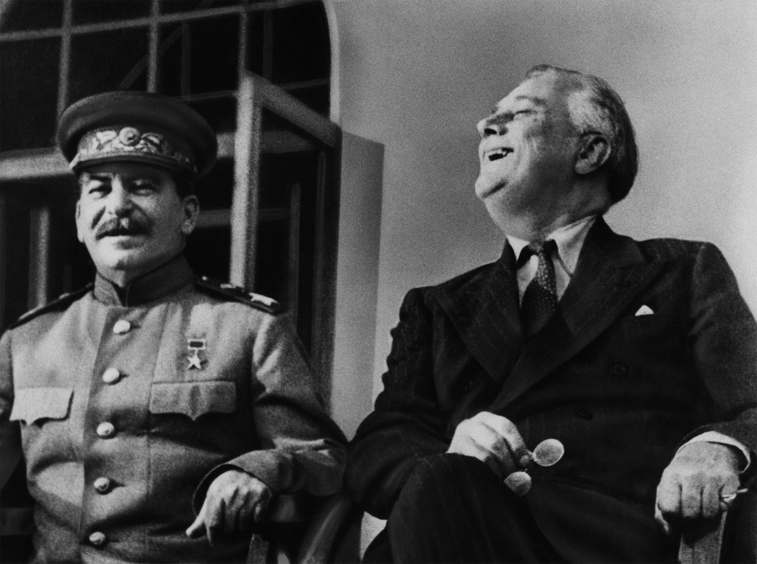 Soviet Premier Josef Stalin and US President Franklin Delano Roosevelt appear on the porch of the Russian embassy in Tehran, Iran in 1943. (Newscom)