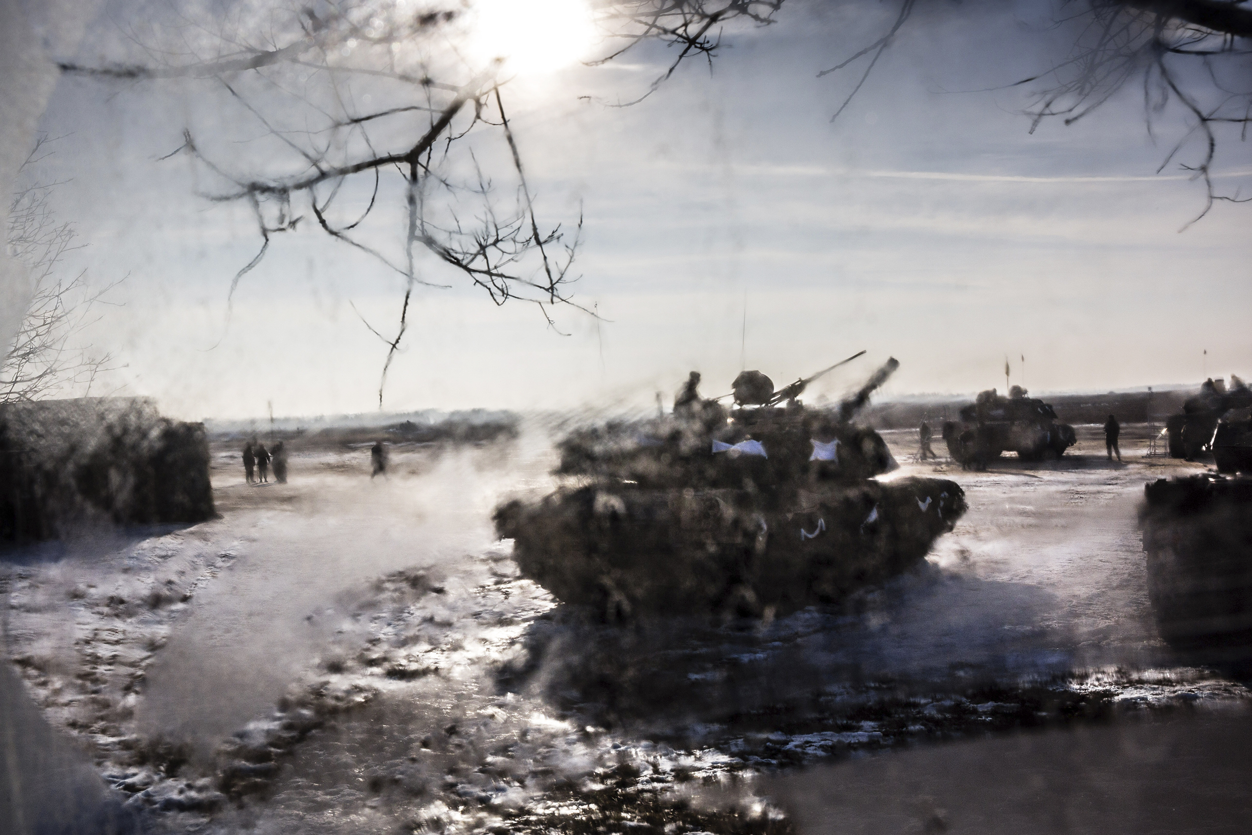 Tanks and troops from the U.S. 3rd Armored Brigade deploy to Poland in January to stand watch against Russia. (Timothy Fadek—Redux)