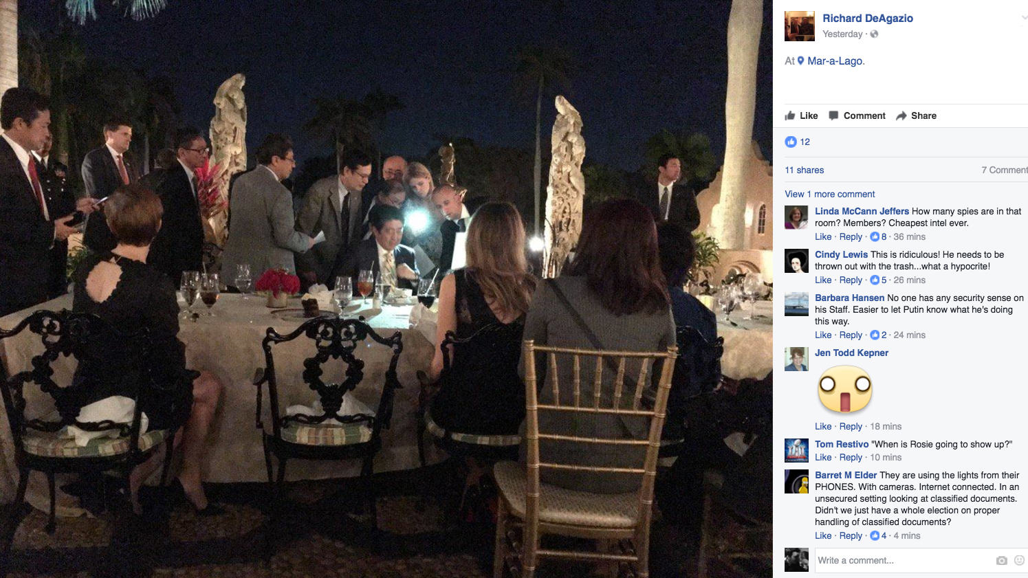 A screengrab of a photo posted on the Facebook page of Richard DeAgazio was said to show Japanese Prime Minister Shinzo Abe huddling with staffers during dinner at President Trump's Mar-a-Lago residence after news spread about North Korea's missile launch.