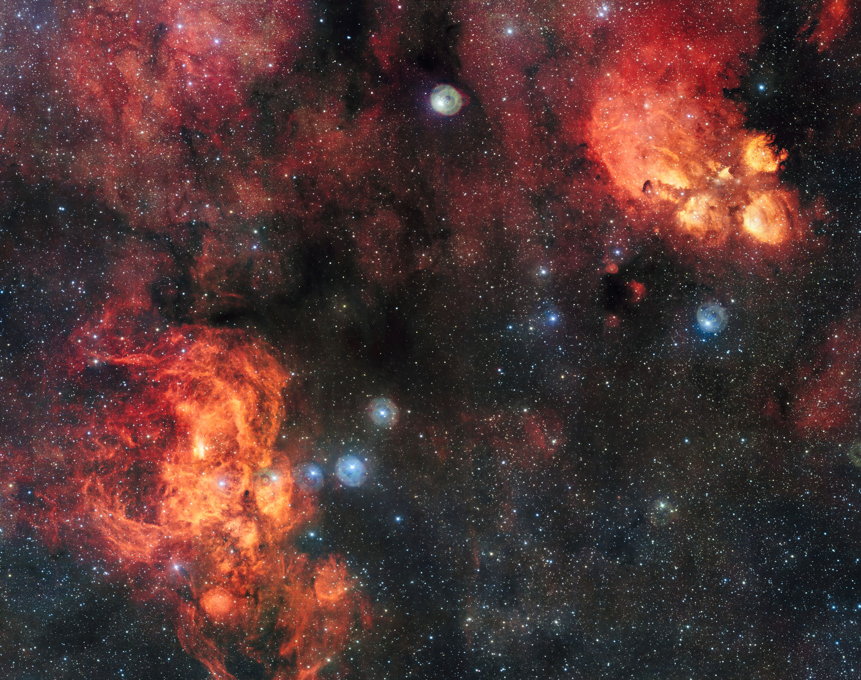 This image, taken from the VLT Survey Telescope, shows the Cat's Paw Nebula (right) and the Lobster Nebula (left).