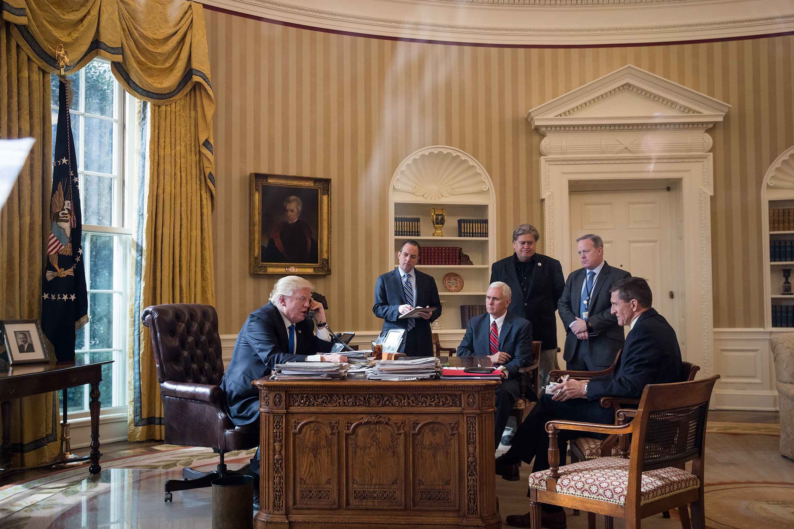 President Donald Trump speaks on the phone with Russian President Vladimir Putin in the Oval Office of the White House, on Jan. 28, 2017.